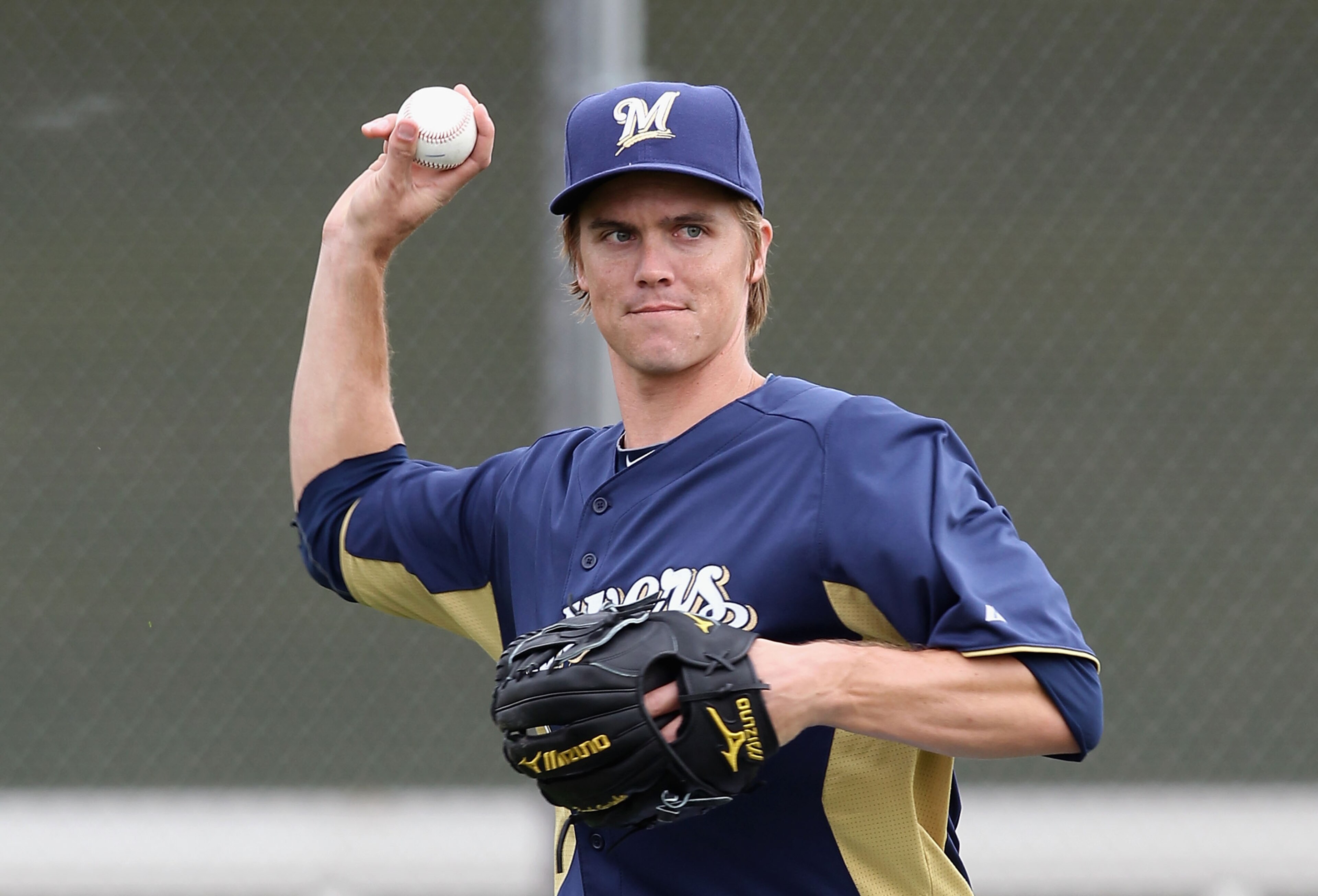 PHOENIX, AZ - FEBRUARY 18: Pitcher Zack Greinke #13 of the Milwaukee Brewers participates in fielding drills during a MLB spring training practice at Maryvale Baseball Park on February 18, 2011 in Phoenix, Arizona. (Photo by Christian Petersen/Getty Ima PHOENIX, AZ - FEBRUARY 18: Pitcher Zack Greinke #13 of the Milwaukee Brewers participates in fielding drills during a MLB spring training practice at Maryvale Baseball Park on February 18, 2011 in Phoenix, Arizona. (Photo by Christian Petersen/Getty Ima