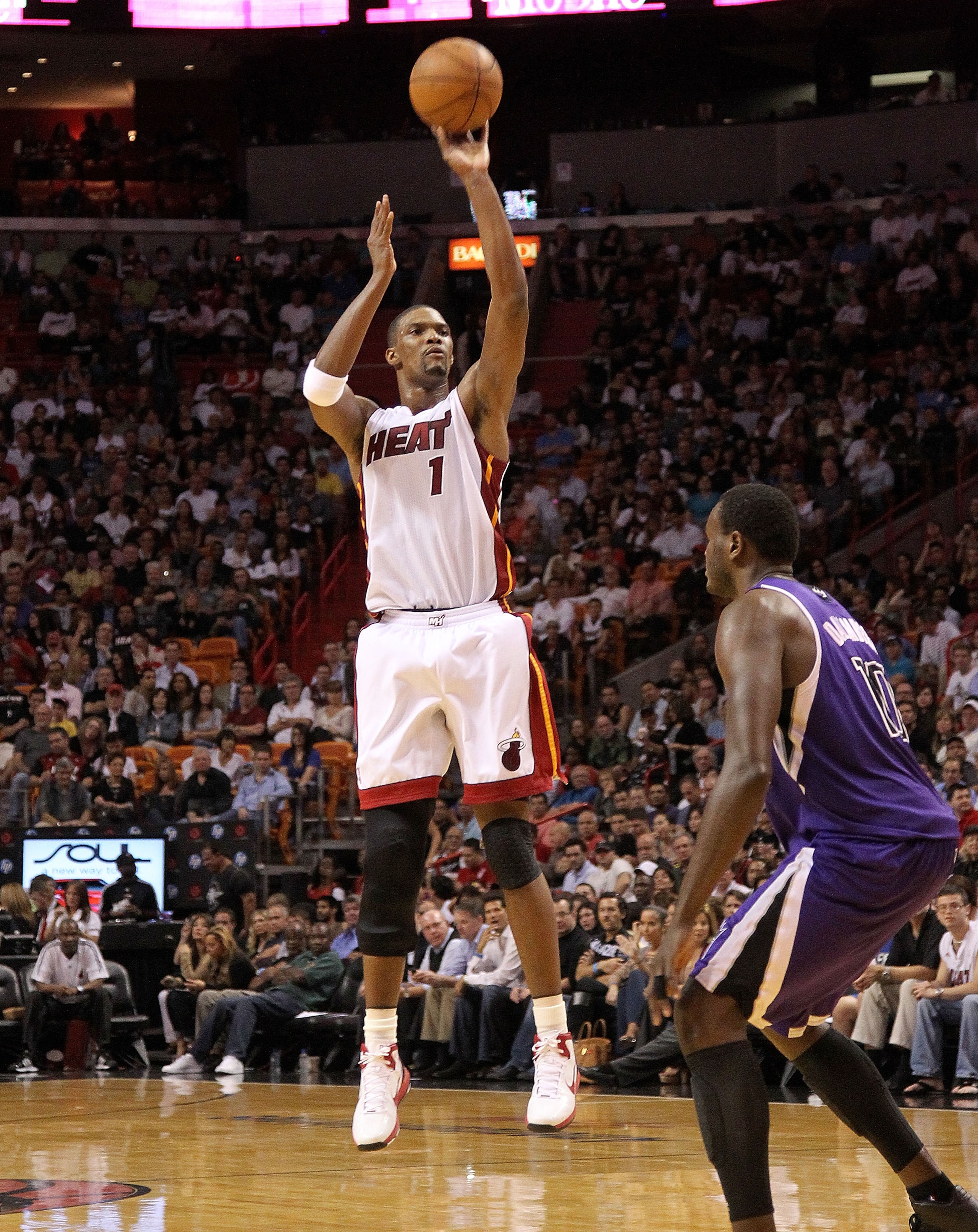MIAMI, FL - FEBRUARY 22: Chris Bosh #1 of the Miami Heat shoots a jump shot during a game against the Sacramento Kings at American Airlines Arena on February 22, 2011 in Miami, Florida. NOTE TO USER: User expressly acknowledges and agrees that, by downloa