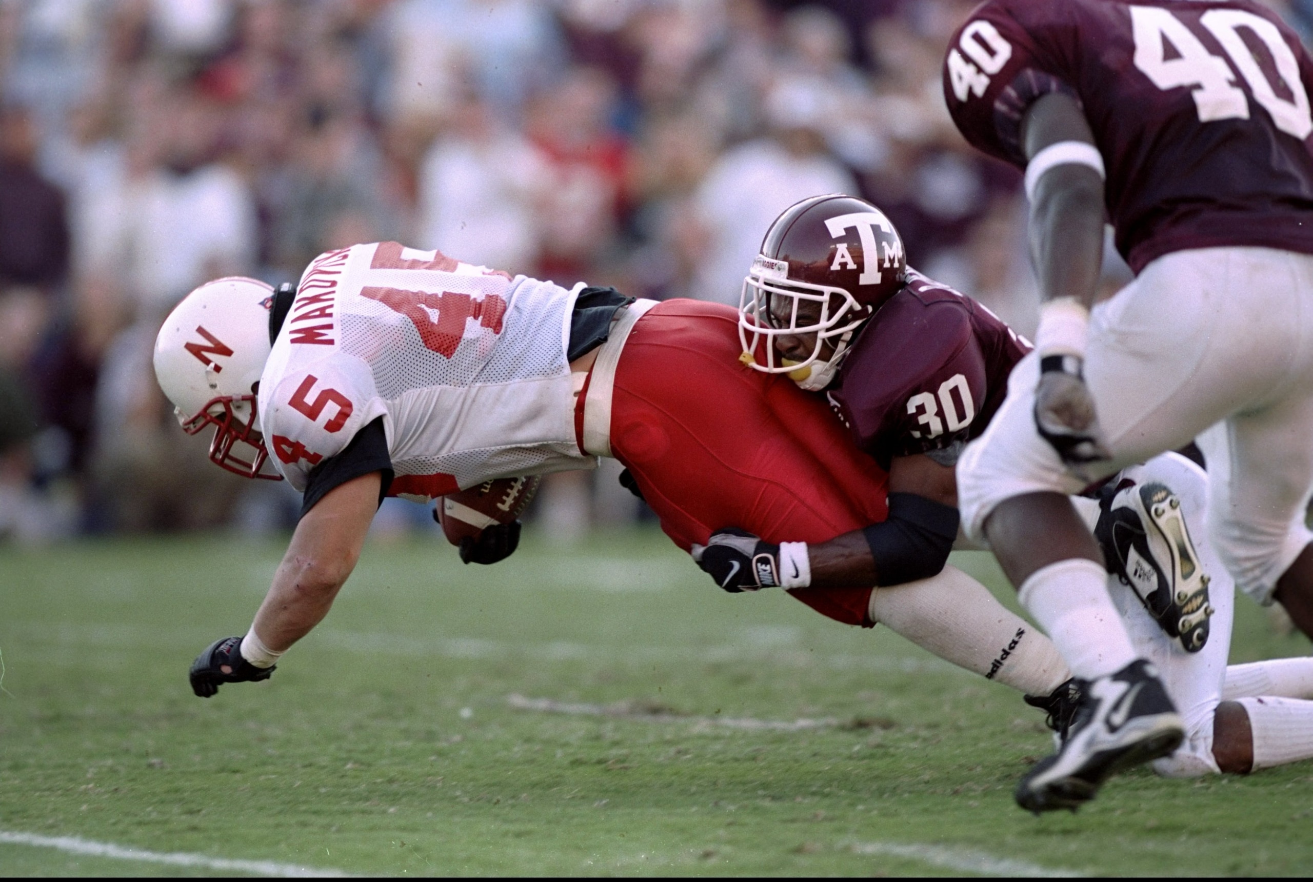 10 Oct 1998:  Fullback Joel Makovicka #45 of the Nebraska Cornhuskers in action against defensive back Brandon Jennings #30 of the Texas A&M Aggies during a game at Kyle Field in College Station, Texas. The Aggies defeated the Cornhuskers 28-21. Mandatory