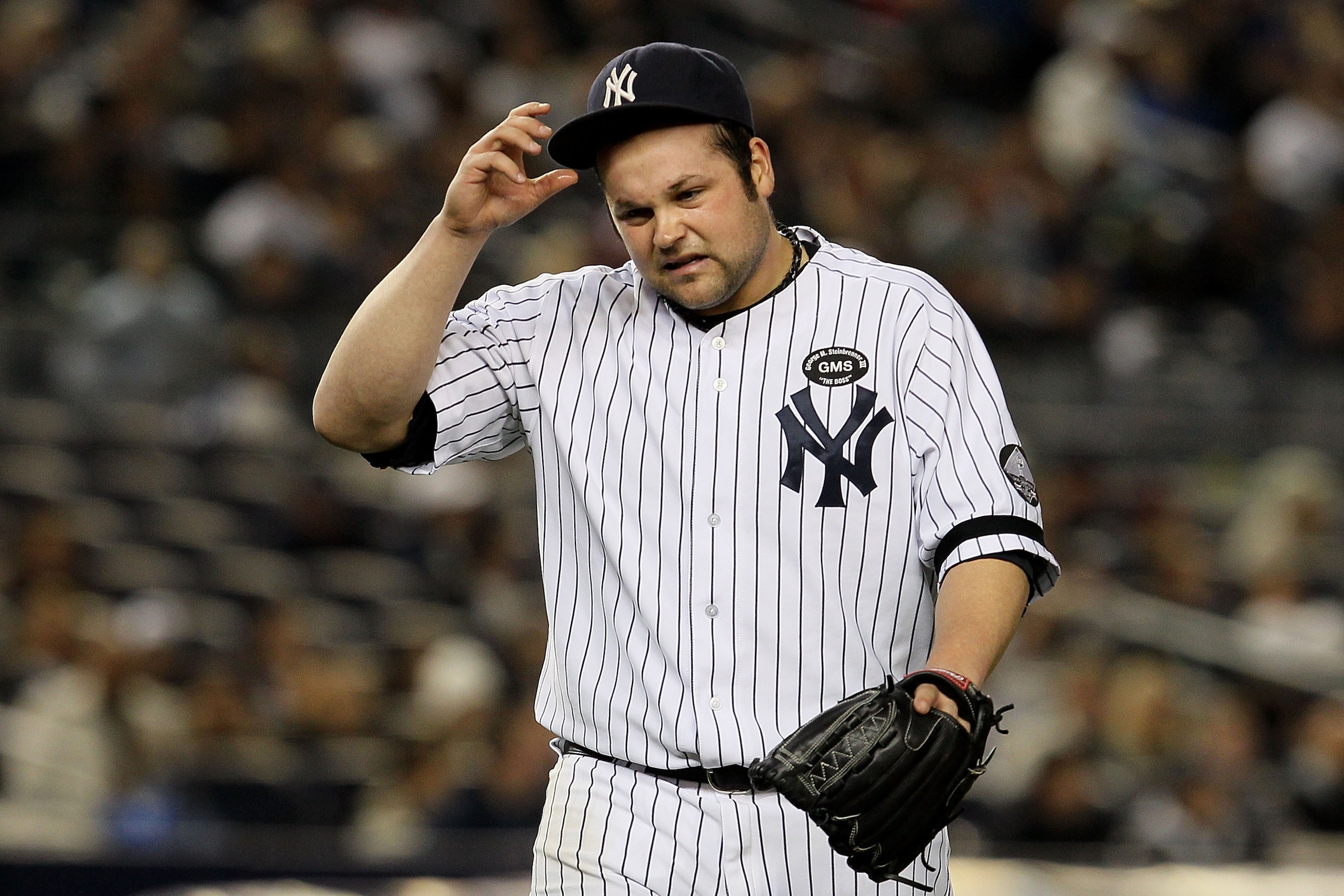NEW YORK - OCTOBER 19: Joba Chamberlain #62 of the New York Yankees reacts as he walks back to the dugout at the end of the top of the eighth inning against the Texas Rangers in Game Four of the ALCS during the 2010 MLB Playoffs at Yankee Stadium on Octo NEW YORK - OCTOBER 19: Joba Chamberlain #62 of the New York Yankees reacts as he walks back to the dugout at the end of the top of the eighth inning against the Texas Rangers in Game Four of the ALCS during the 2010 MLB Playoffs at Yankee Stadium on Octo