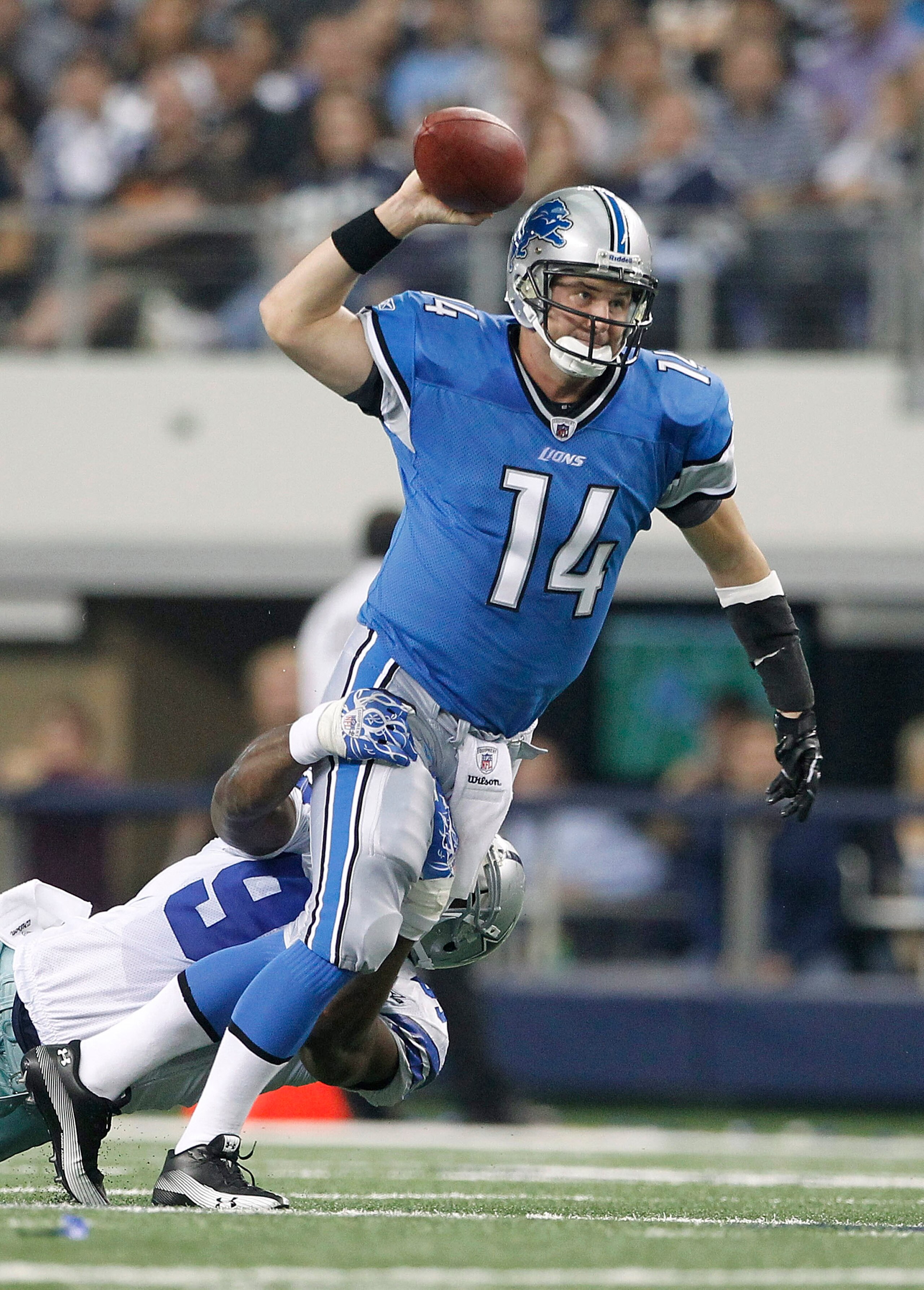 ARLINGTON, TX - NOVEMBER 21: Shaun Hill #14 of the Detroit Lions throws the ball as DeMarcus Ware #94 of the Dallas Cowboys makes the sack during the game at Dallas Stadium on November 21, 2010 in Arlington, Texas. The Cowboys defeated the Lions 35-19. ( ARLINGTON, TX - NOVEMBER 21: Shaun Hill #14 of the Detroit Lions throws the ball as DeMarcus Ware #94 of the Dallas Cowboys makes the sack during the game at Dallas Stadium on November 21, 2010 in Arlington, Texas. The Cowboys defeated the Lions 35-19. (