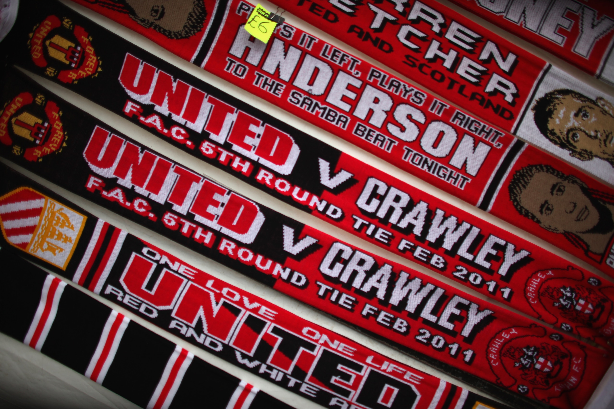 MANCHESTER, UNITED KINGDOM - FEBRUARY 19:  Commemorative scarves for sale outside Old Trafford before Crawley Town take on Manchester United in the FA Cup fifth round on February 19, 2011 in Manchester, England. The team from West Sussex are hoping to mak