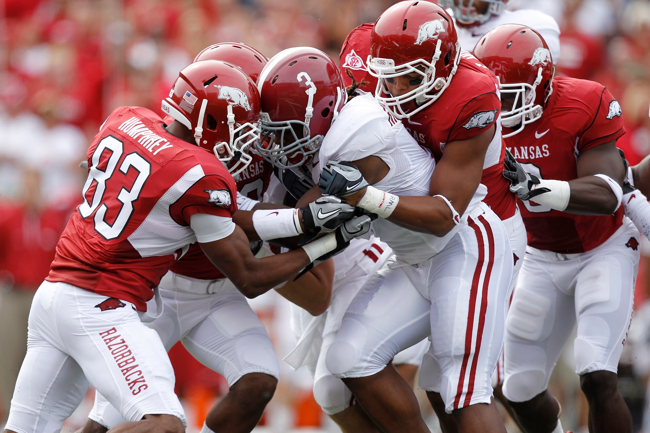 FAYETTEVILLE - SEPTEMBER 25: Trent Richardson #3 of the Alabama Crimson Tide gets tackled by a group of Arkansas Razorbacks defenders during the first half at Donald W. Reynolds Razorback Stadium on September 25, 2010 in Fayetteville, Arkansas. (Photo by FAYETTEVILLE - SEPTEMBER 25: Trent Richardson #3 of the Alabama Crimson Tide gets tackled by a group of Arkansas Razorbacks defenders during the first half at Donald W. Reynolds Razorback Stadium on September 25, 2010 in Fayetteville, Arkansas. (Photo by