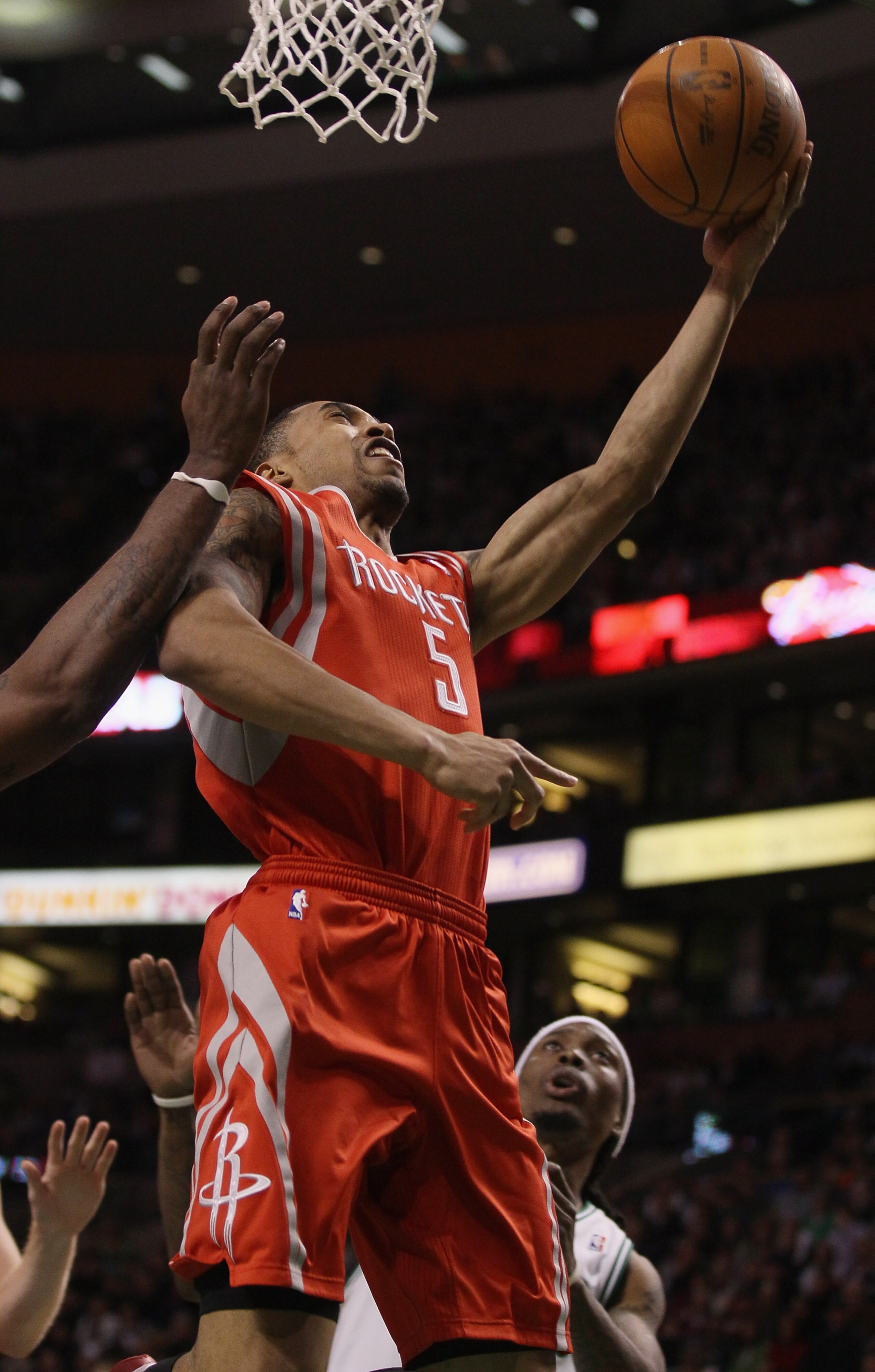 BOSTON, MA - JANUARY 10:  Courtney Lee #5 of the Houston Rockets takes a shot as Marquis Daniels #8 of the Boston Celtics defends on January 10, 2011 at the TD Garden in Boston, Massachusetts.  The Rockets defeated the Celtics 108-102. NOTE TO USER: User