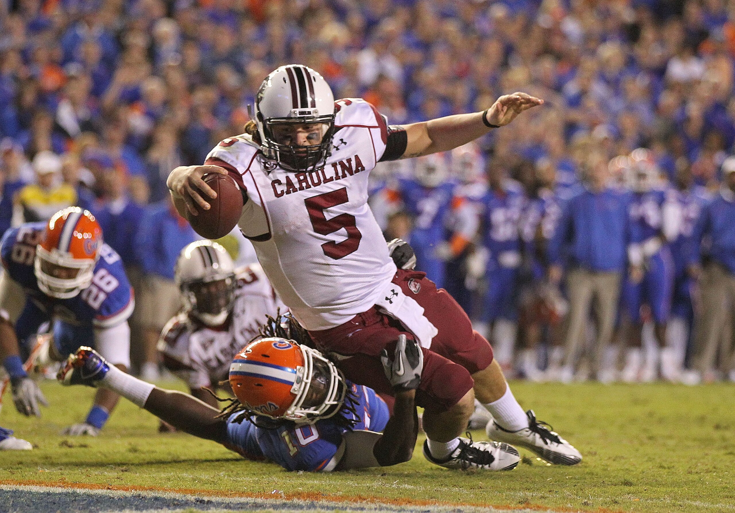 GAINESVILLE, FL - NOVEMBER 13: Stephen Garcia #5 of the South Carolina Gamecocks rushes for a touchdown against Will Hill #10 of the Florida Gators during a game at Ben Hill Griffin Stadium on November 13, 2010 in Gainesville, Florida. The Gamecocks beat GAINESVILLE, FL - NOVEMBER 13: Stephen Garcia #5 of the South Carolina Gamecocks rushes for a touchdown against Will Hill #10 of the Florida Gators during a game at Ben Hill Griffin Stadium on November 13, 2010 in Gainesville, Florida. The Gamecocks beat