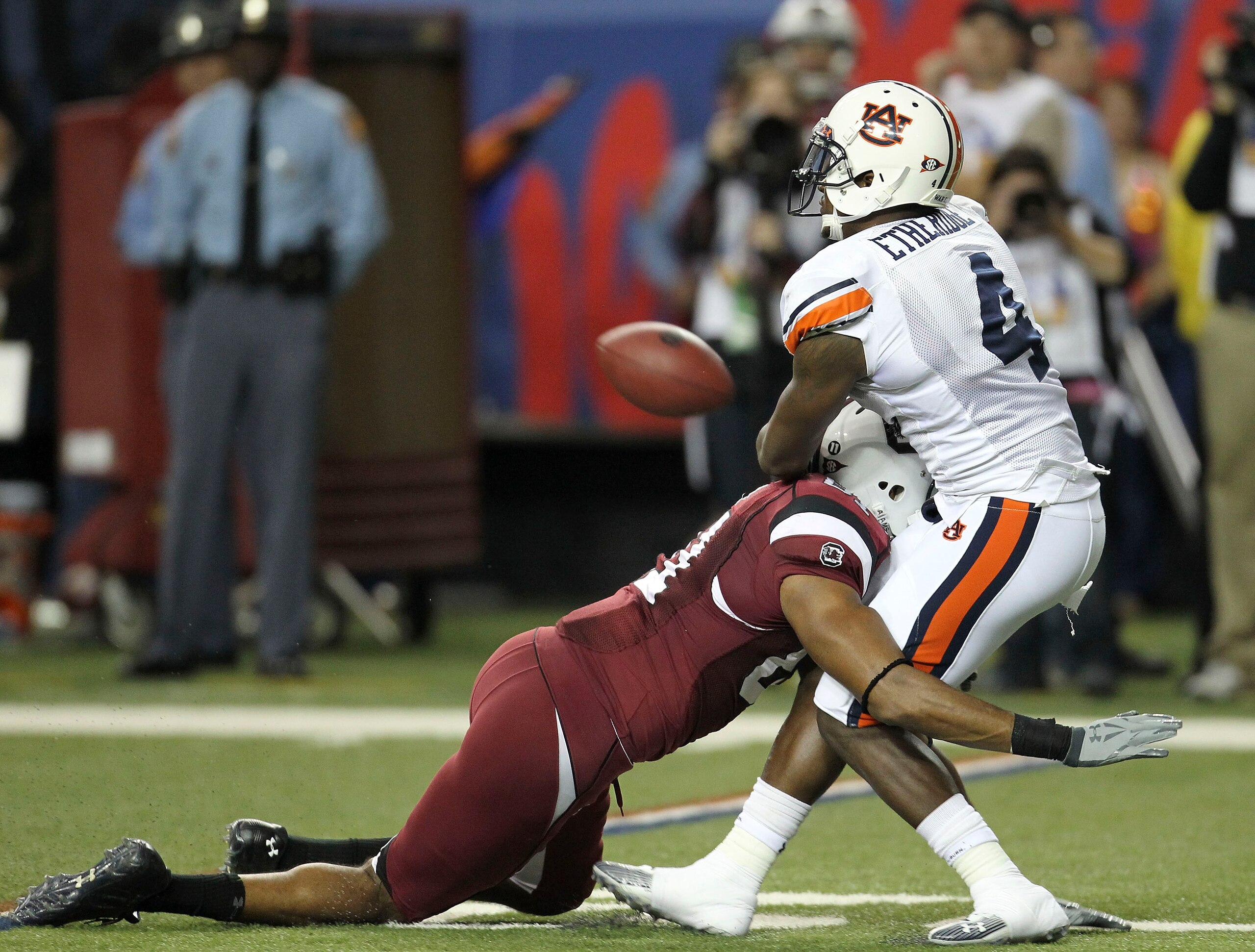 ATLANTA - DECEMBER 4: Safety Zac Etheridge #4 of the Auburn Tigers commits a pass interference penalty on wide receiver Tori Gurley #81 of the South Carolina Gamecocks at the end of the first half during the 2010 SEC Championship at Georgia Dome on Decem ATLANTA - DECEMBER 4: Safety Zac Etheridge #4 of the Auburn Tigers commits a pass interference penalty on wide receiver Tori Gurley #81 of the South Carolina Gamecocks at the end of the first half during the 2010 SEC Championship at Georgia Dome on Decem