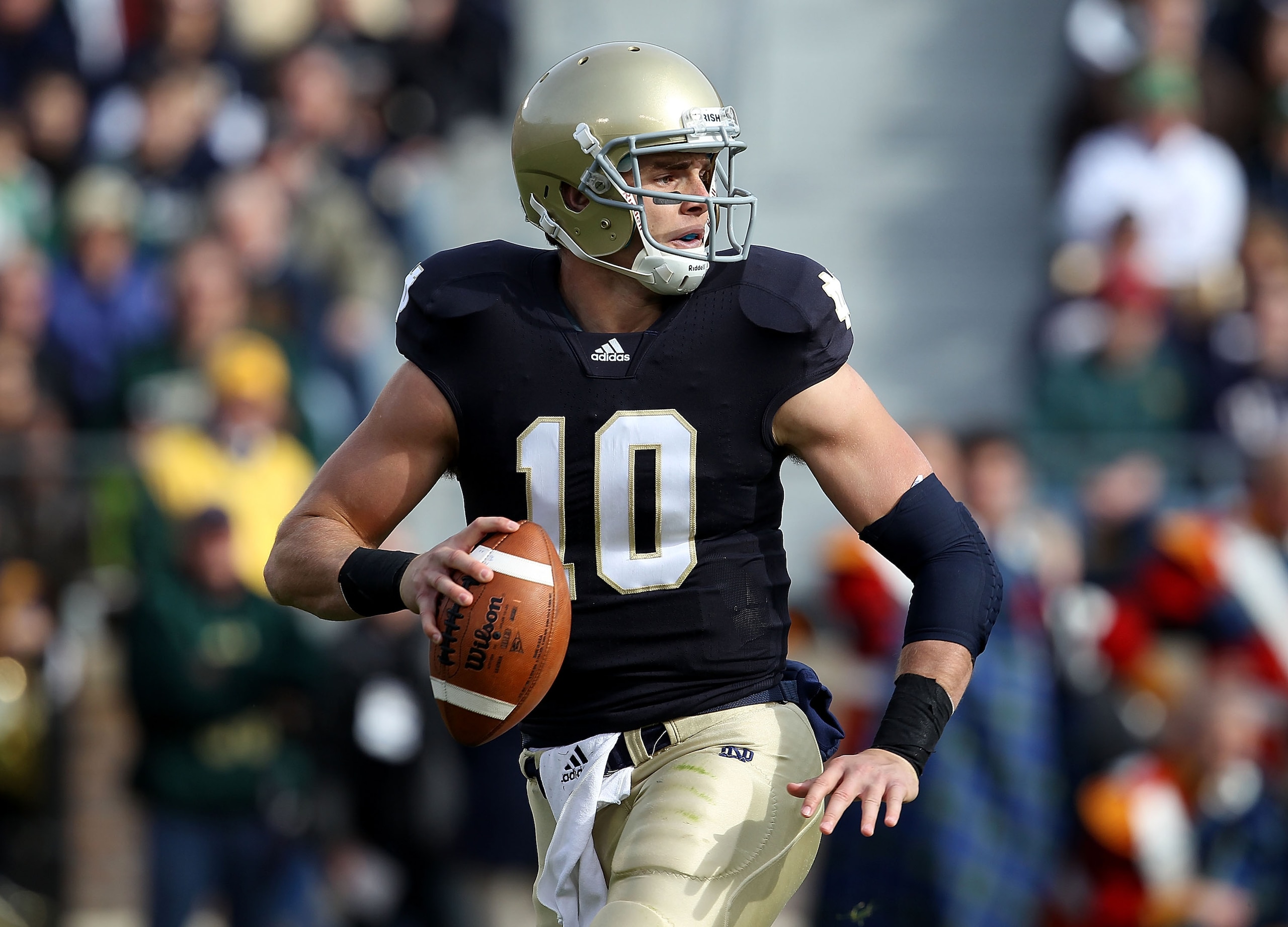 SOUTH BEND, IN - OCTOBER 30: Dayne Crist #10 of the Notre Dame Fighting Irish looks for a receiver against the Tulsa Golden Hurricane at Notre Dame Stadium on October 30, 2010 in South Bend, Indiana. Tulsa defeated Notre Dame 28-27. (Photo by Jonathan Dan