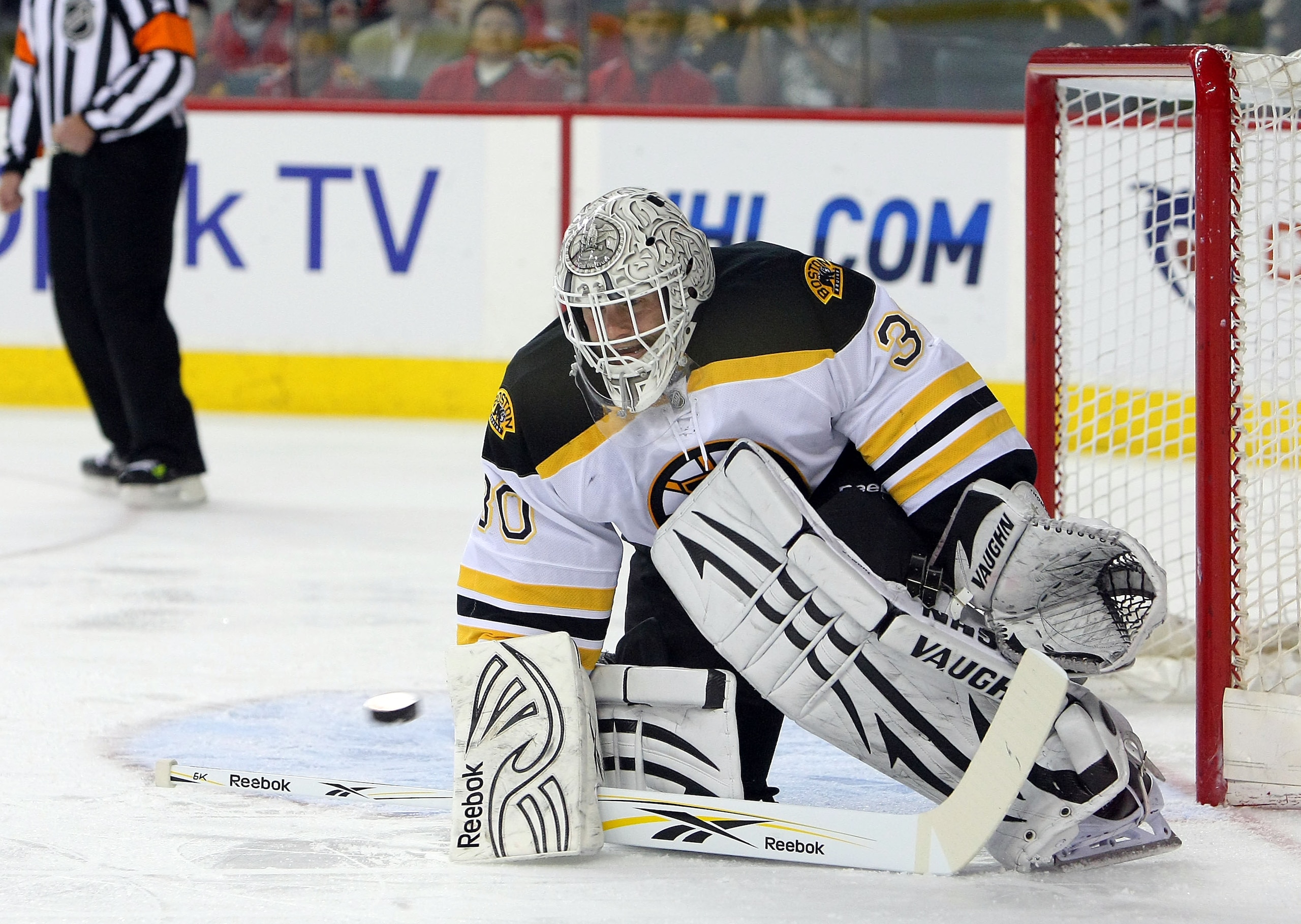 CALGARY,CANADA - FEBRUARY 22:  Tim Thomas #30 of the Boston Bruins makes a save against the Calgary Flames their NHL game at Scotiabank Saddledome, February 22,2011 in Calgary, Alberta, Canada.(Photo By Dave Sandford/Getty Images)