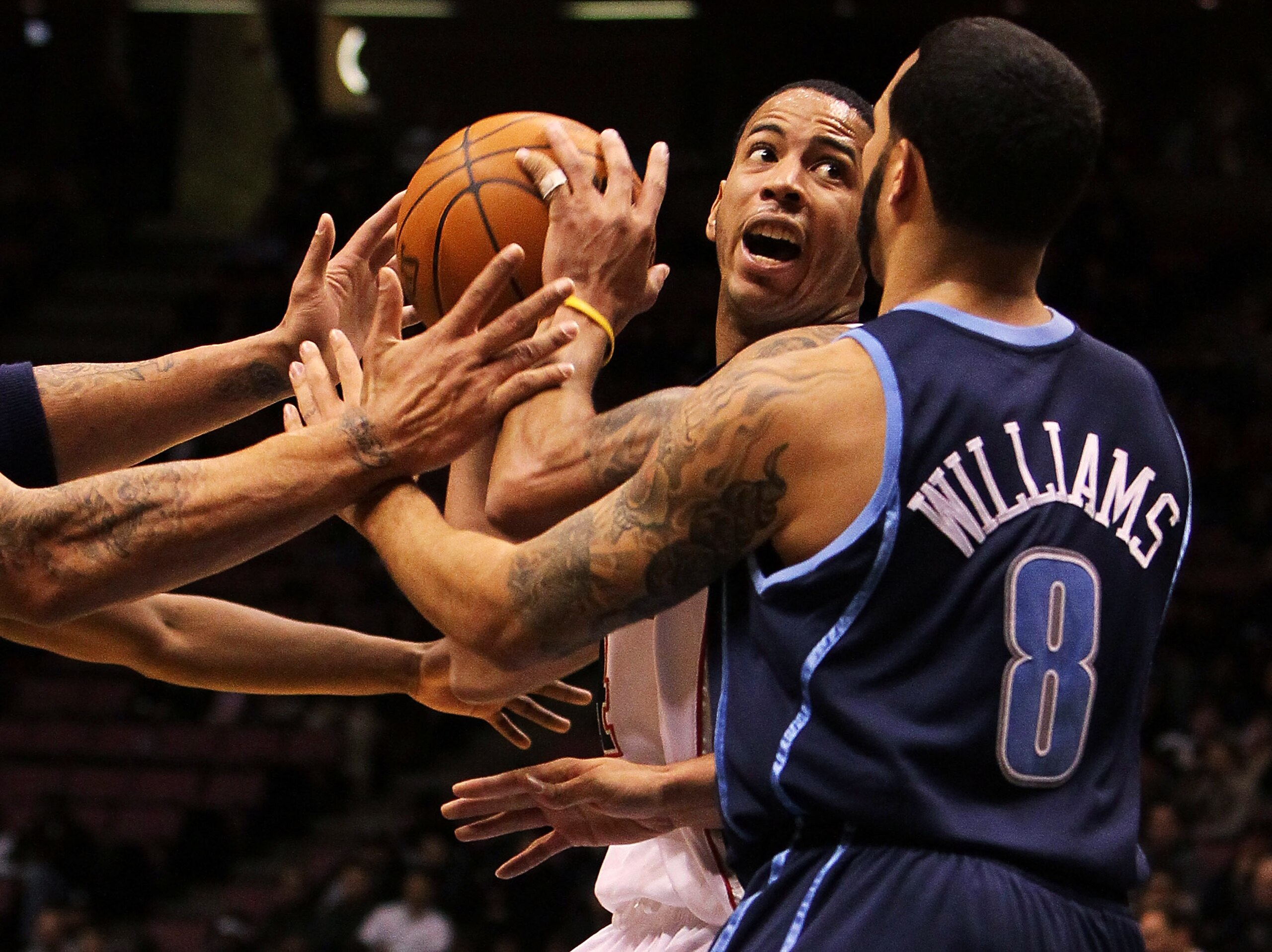 EAST RUTHERFORD, NJ - DECEMBER 16:  Devin Harris #34 of the New Jersey Nets is guarded by Deron Williams #8 of the Utah Jazz during their game on December 16, 2009 at the IZOD Center in East Rutherford, New Jersey.  NOTE TO USER: User expressly acknowledg