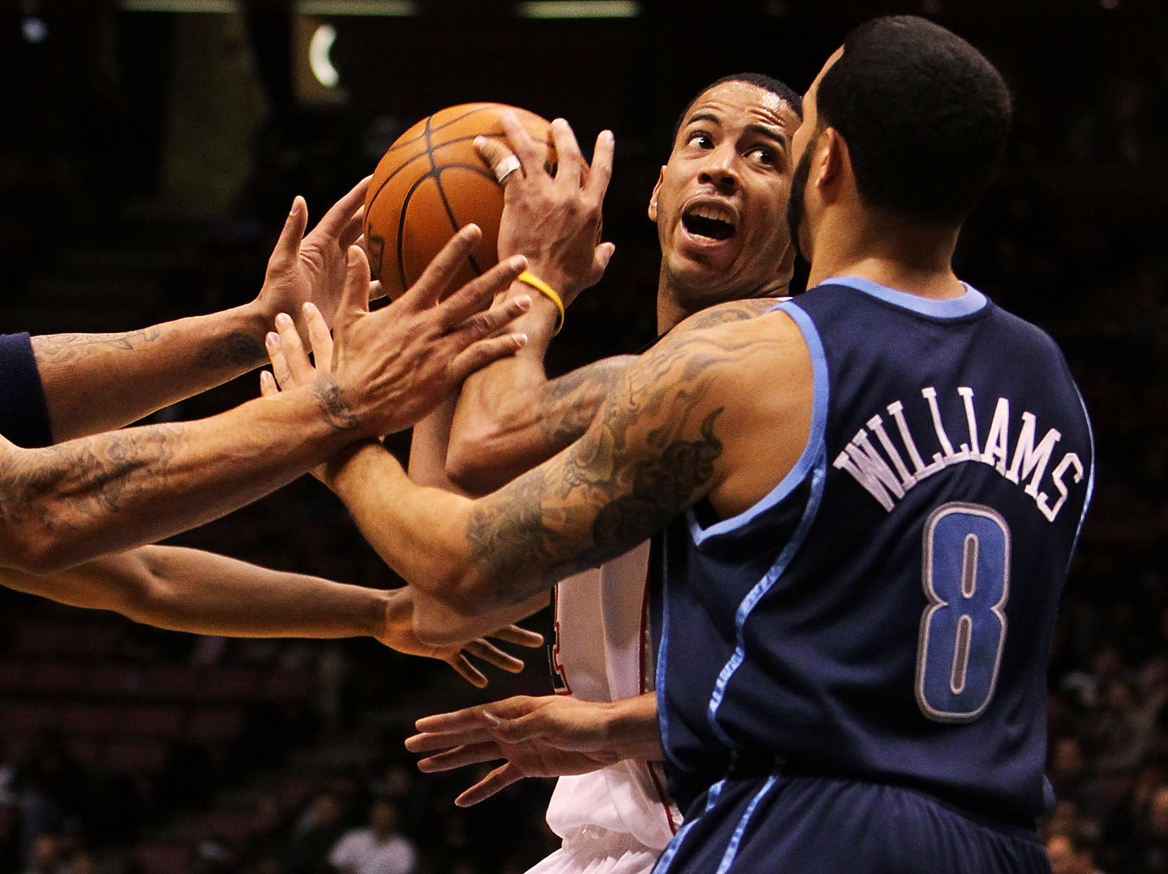 EAST RUTHERFORD, NJ - DECEMBER 16:  Devin Harris #34 of the New Jersey Nets is guarded by Deron Williams #8 of the Utah Jazz during their game on December 16, 2009 at the IZOD Center in East Rutherford, New Jersey.  NOTE TO USER: User expressly acknowledg