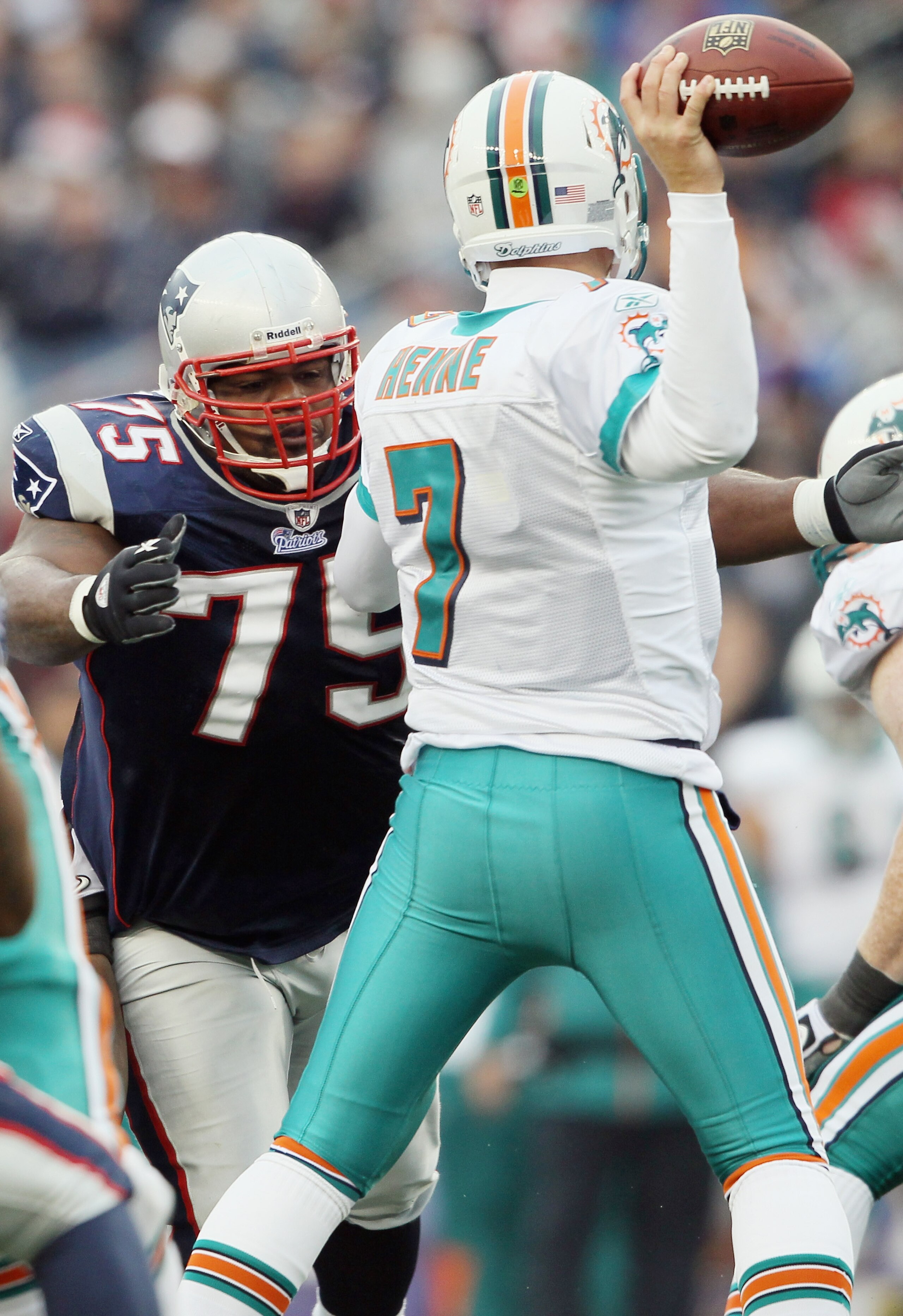 FOXBORO, MA - JANUARY 02:  Vince Wilfork #75 of the New England Patriots pressures Chad Henne #7 of the Miami Dolphins on January 2, 2011 at Gillette Stadium in Foxboro, Massachusetts.  (Photo by Elsa/Getty Images)