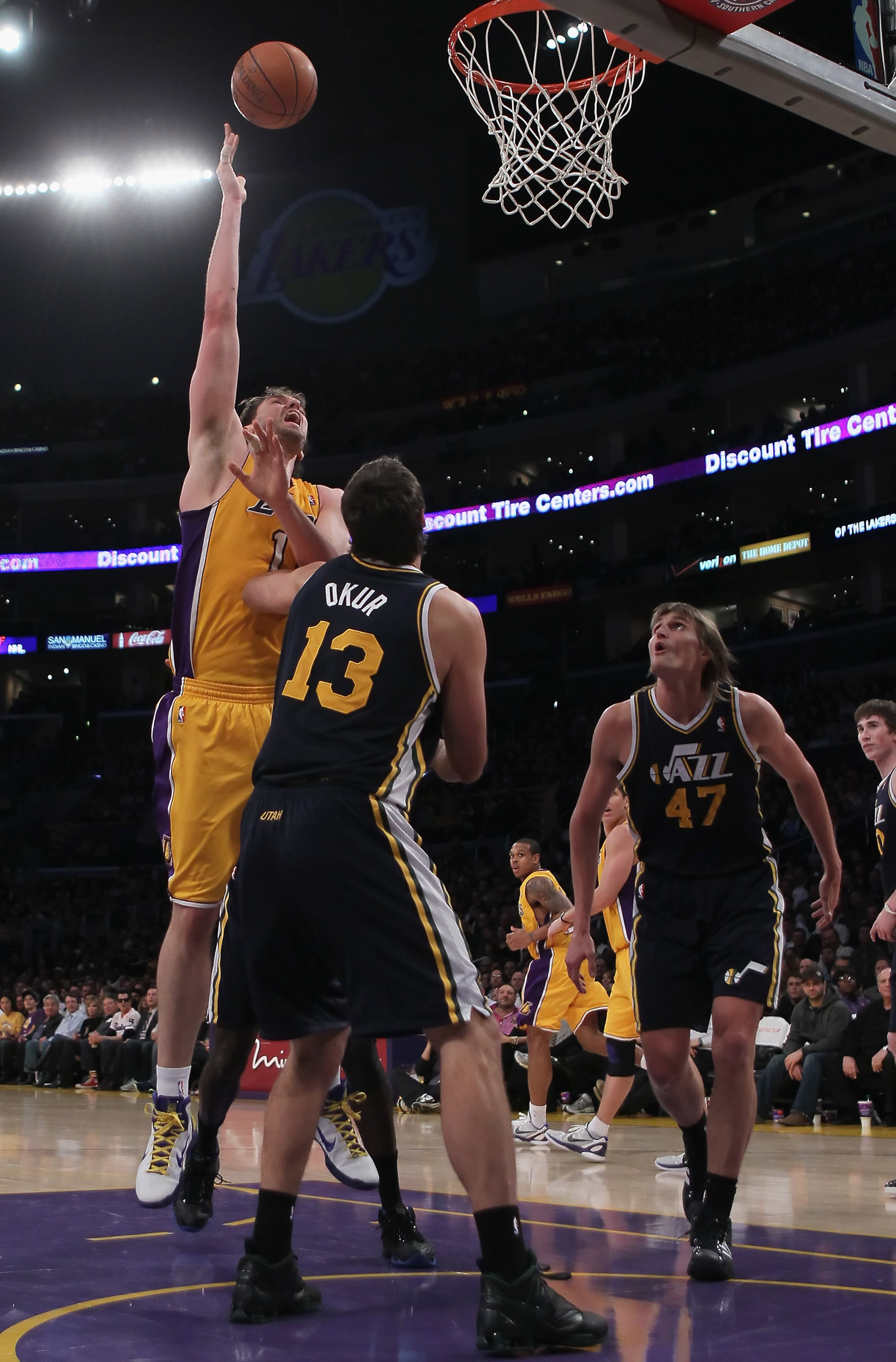 LOS ANGELES, CA - JANUARY 25:  Pau Gasol #16 of the Los Angeles Lakers shoots over Mehmet Okur #13 and Andrei Kirilenko #47 of the Utah Jazz in the second half at Staples Center on January 25, 2011 in Los Angeles, California. The Lakers defeated the Jazz