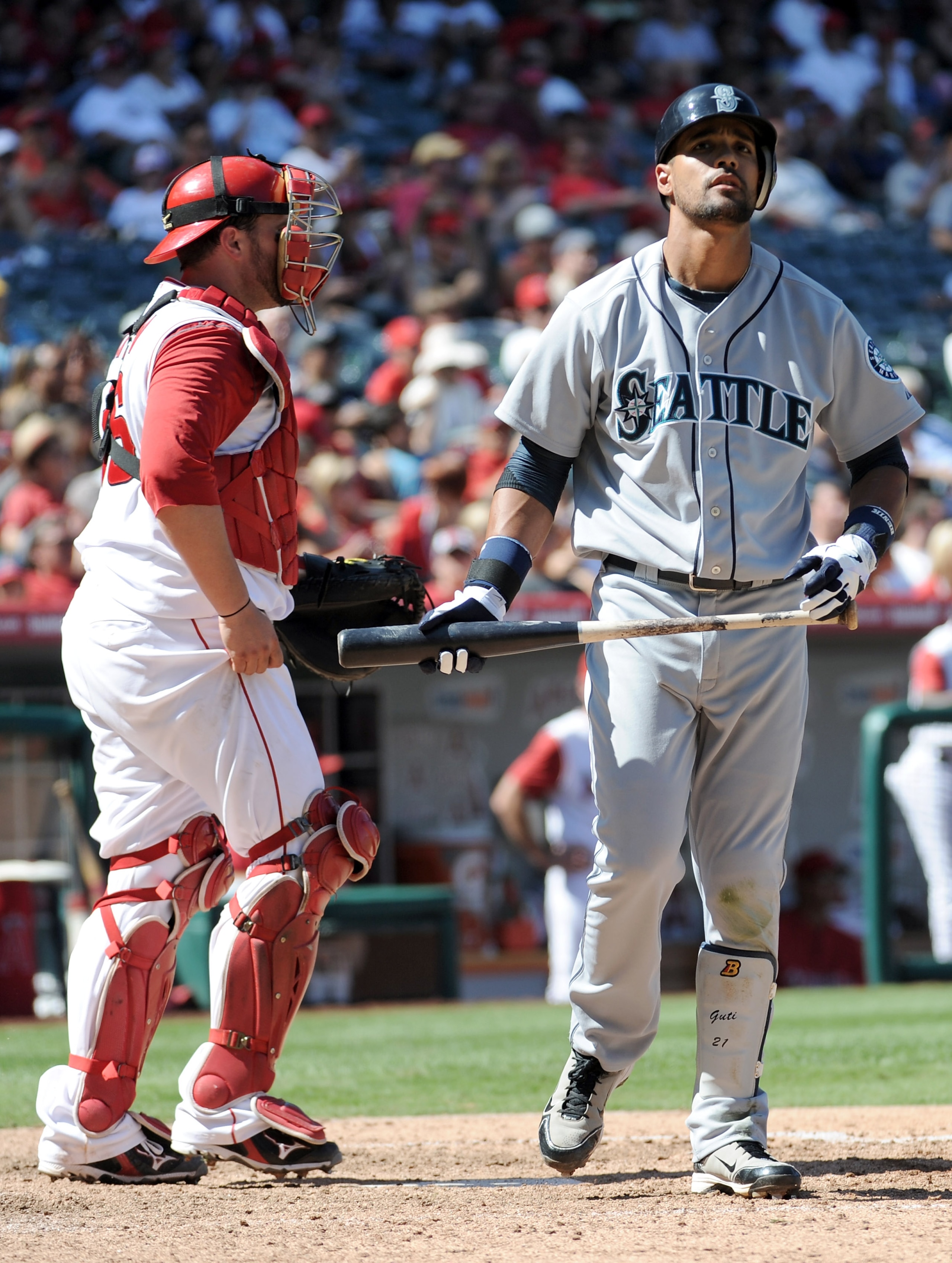 ANAHEIM, CA - SEPTEMBER 12:  Franklin Gutierrez #21 of the Seattle Mariners strikesout with base runners in front of  Bobby Wilson #46 of the Los Angeles Angels of Anaheim during the eighth inning at Angel Stadium on September 12, 2010 in Anaheim, Califor