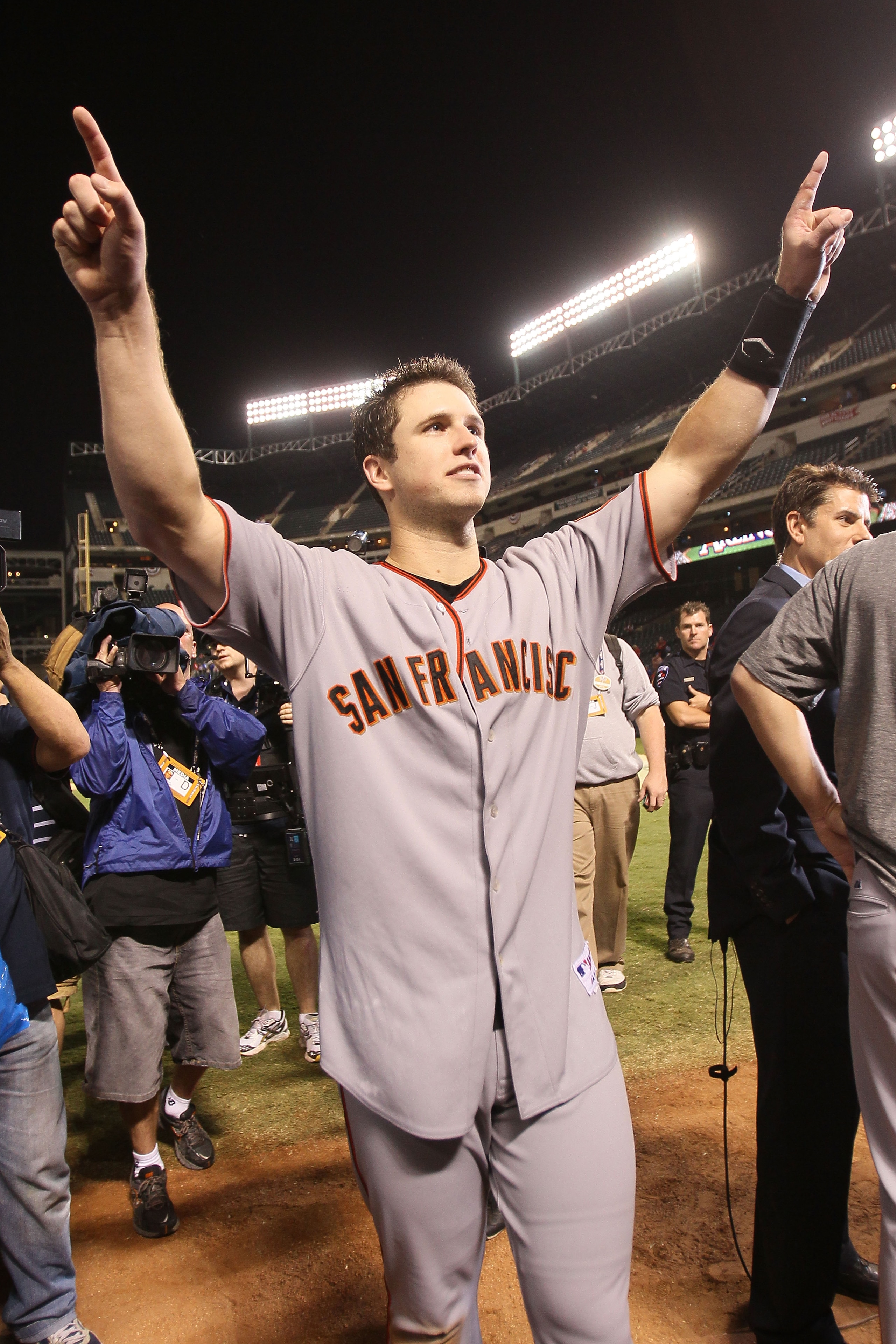 ARLINGTON, TX - NOVEMBER 01: Buster Posey #28 of the San Francisco Giants celebrates on the field after the Giants won 3-1 the Texas Rangers in Game Five of the 2010 MLB World Series at Rangers Ballpark in Arlington on November 1, 2010 in Arlington, Texa ARLINGTON, TX - NOVEMBER 01: Buster Posey #28 of the San Francisco Giants celebrates on the field after the Giants won 3-1 the Texas Rangers in Game Five of the 2010 MLB World Series at Rangers Ballpark in Arlington on November 1, 2010 in Arlington, Texa
