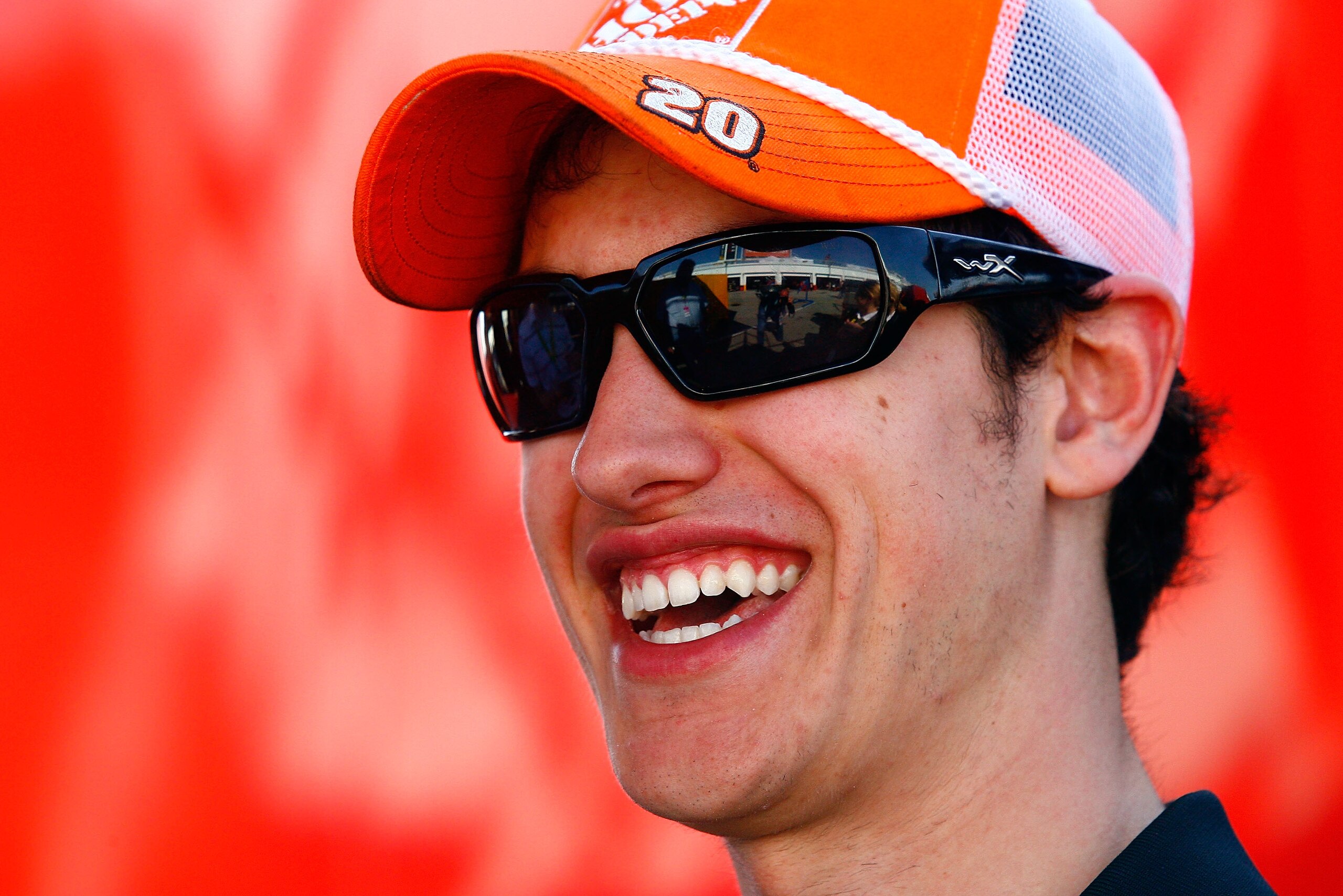 DAYTONA BEACH, FL - FEBRUARY 18:  Joey Logano, driver of the #20 Home Depot Toyota, waits in the garage area prior to practice for the NASCAR Sprint Cup Series Daytona 500 at Daytona International Speedway on February 18, 2011 in Daytona Beach, Florida.
