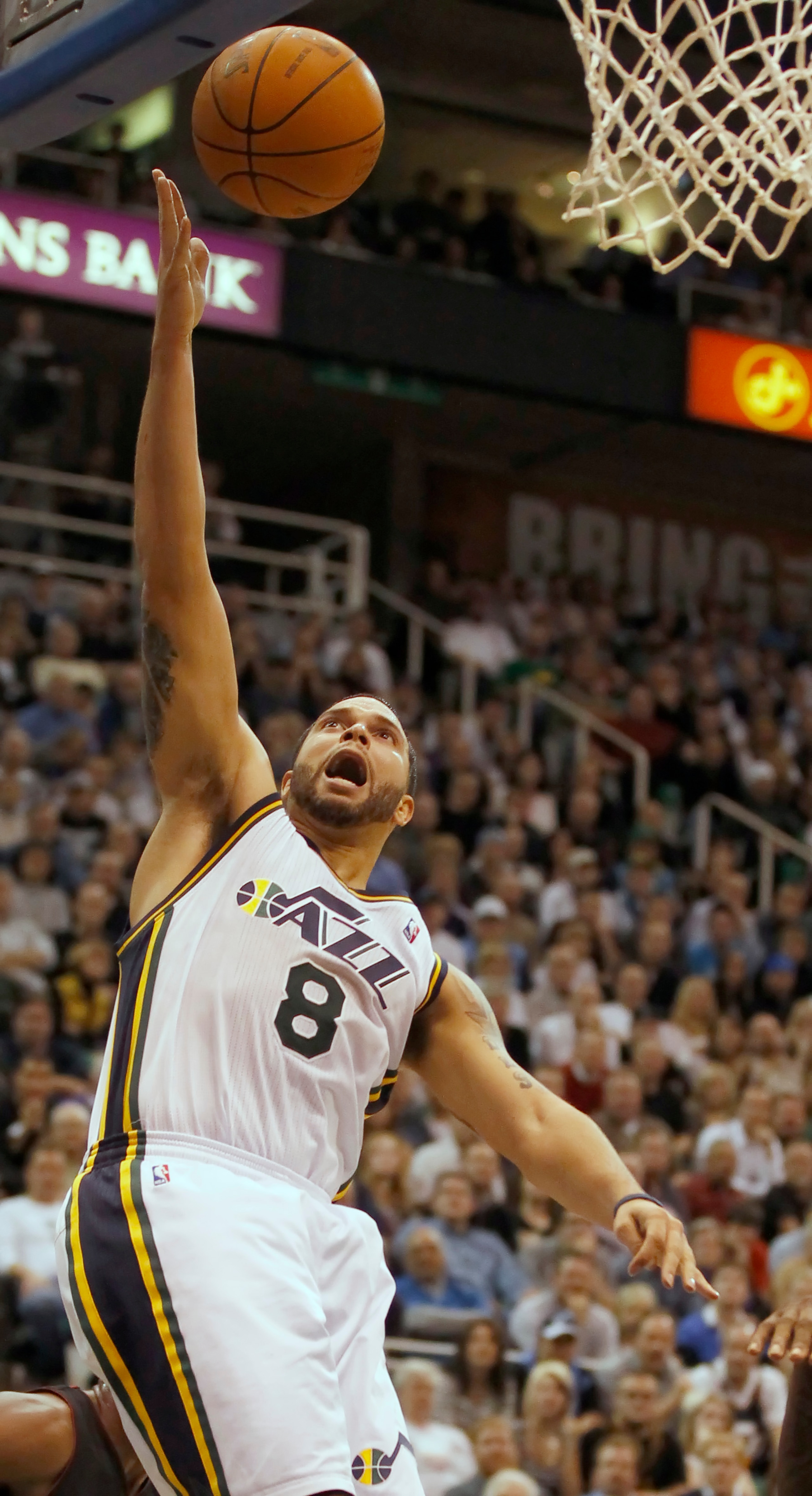 SALT LAKE CITY, UT - DECEMBER 8:  Deron Williams #8 of the Utah Jazz lays the ball in during a game against the Miami Heat during the second half of an NBA game December 8, 2010 at Energy Solutions Arena in Salt Lake City, Utah. The Heat beat the Jazz 111