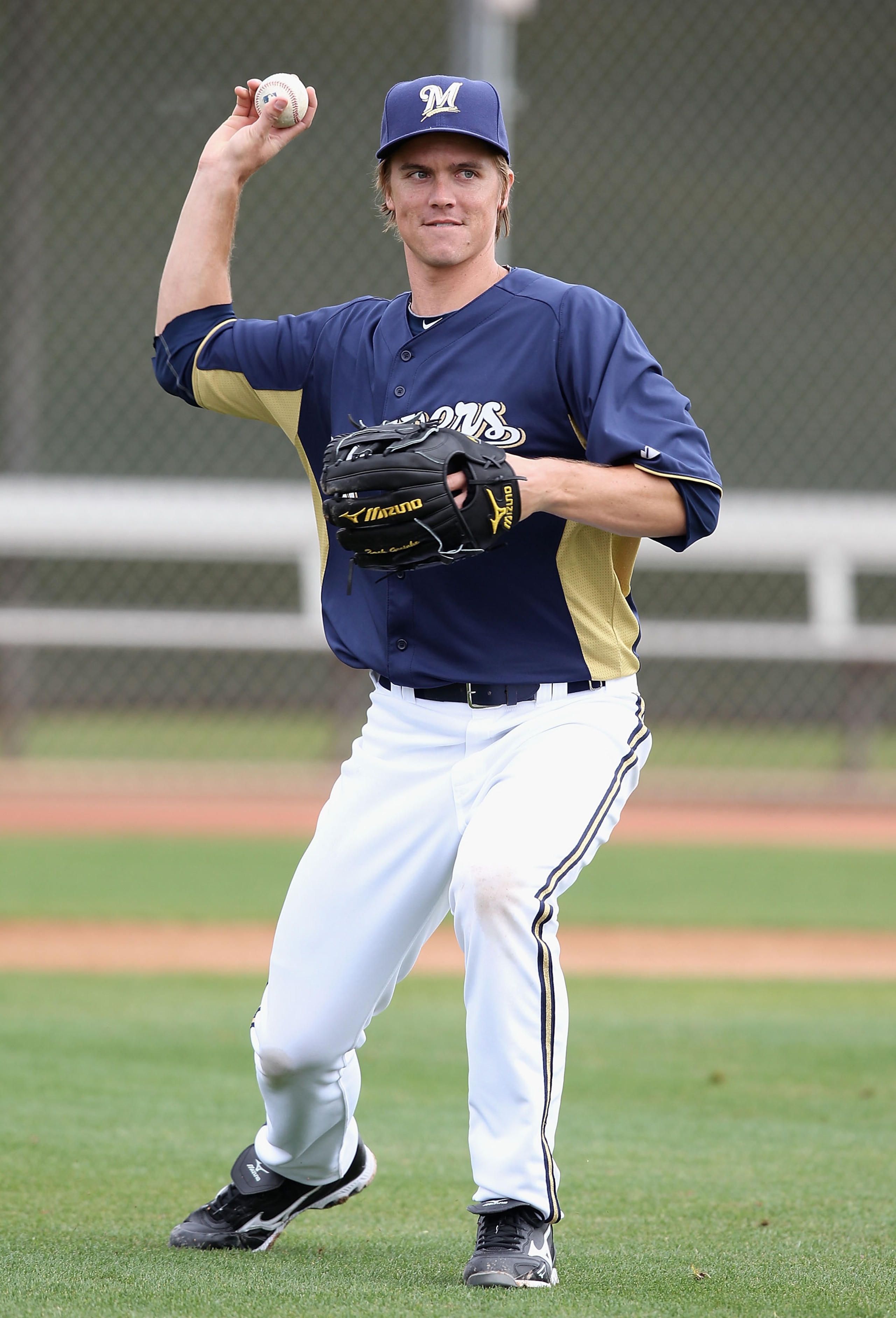 PHOENIX, AZ - FEBRUARY 18:  Pitcher Zack Greinke #13 of the Milwaukee Brewers participates in fielding drills during a MLB spring training practice at Maryvale Baseball Park on February 18, 2011 in Phoenix, Arizona.  (Photo by Christian Petersen/Getty Ima