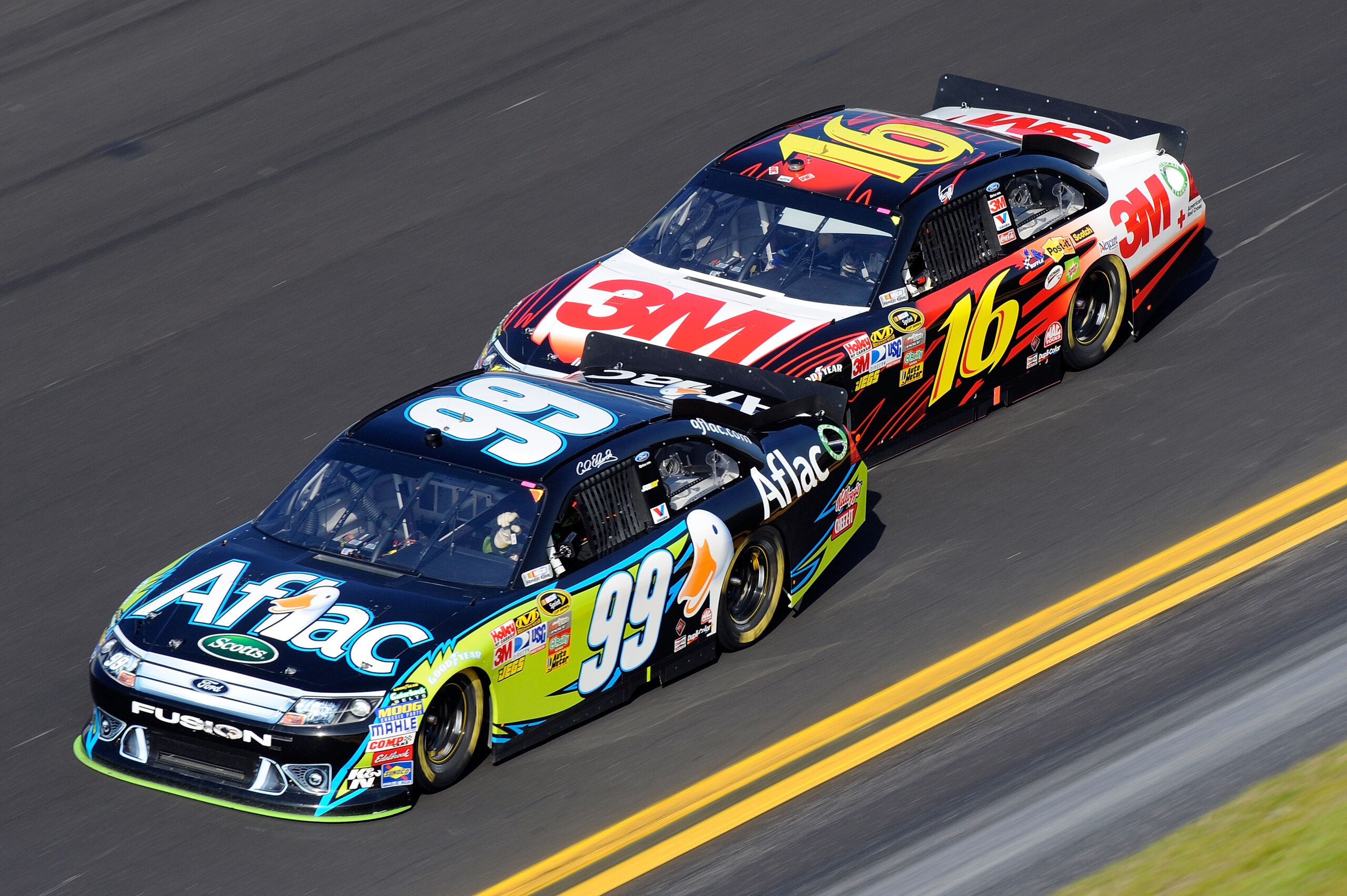 DAYTONA BEACH, FL - FEBRUARY 17:  Greg Biffle, driver of the #16 3M Ford, drafts behind Carl Edwards, driver of the #99 Aflac Ford, during the second race of the NASCAR Sprint Cup Series Gatorade Duel at Daytona International Speedway on February 17, 2011