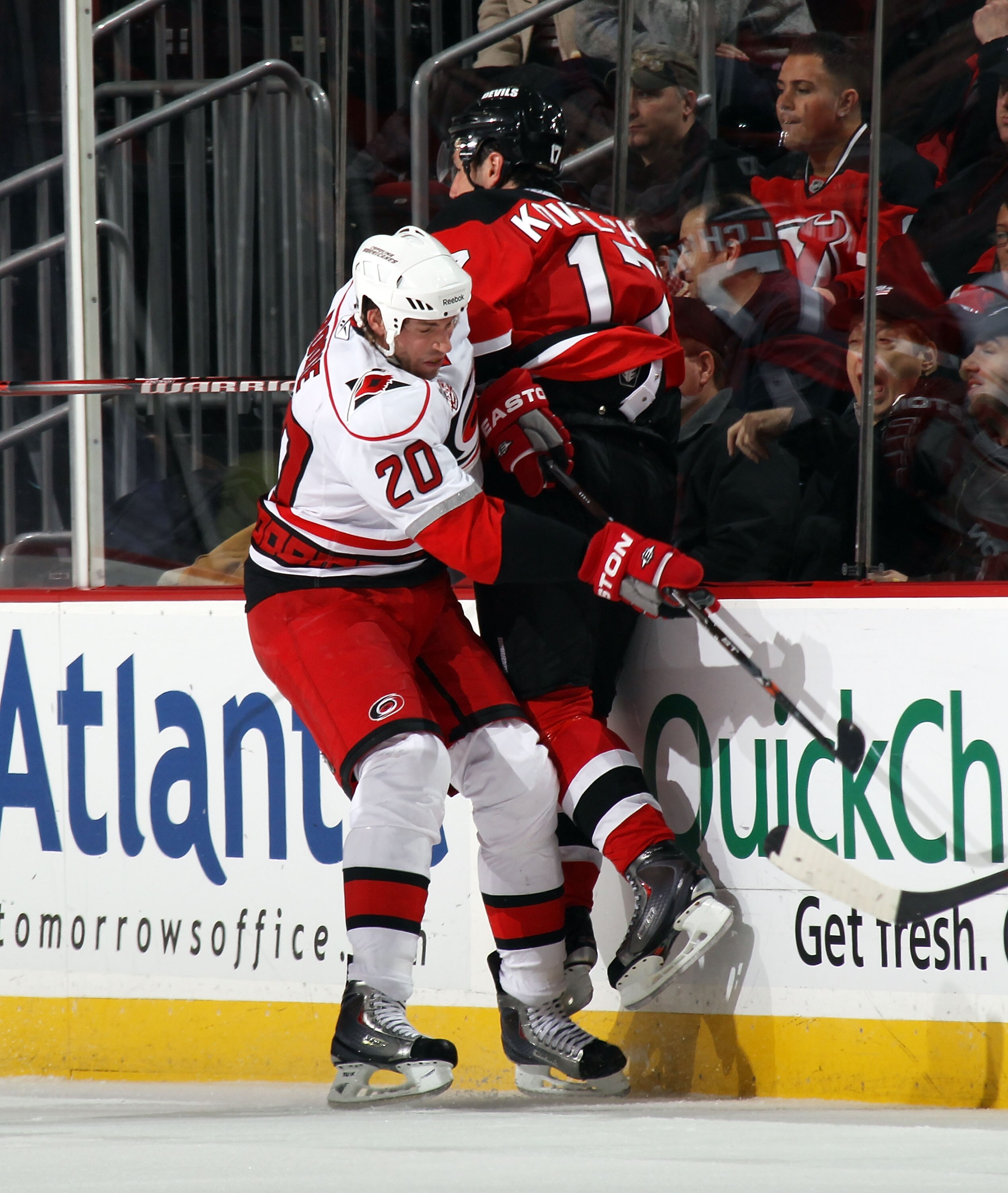 NEWARK, NJ - FEBRUARY 16: Troy Bodie #20 of the Carolina Hurricanes boards Ilya Kovalchuk #17 of the New Jersey Devils at the Prudential Center on February 16, 2011 in Newark, New Jersey.  (Photo by Bruce Bennett/Getty Images)