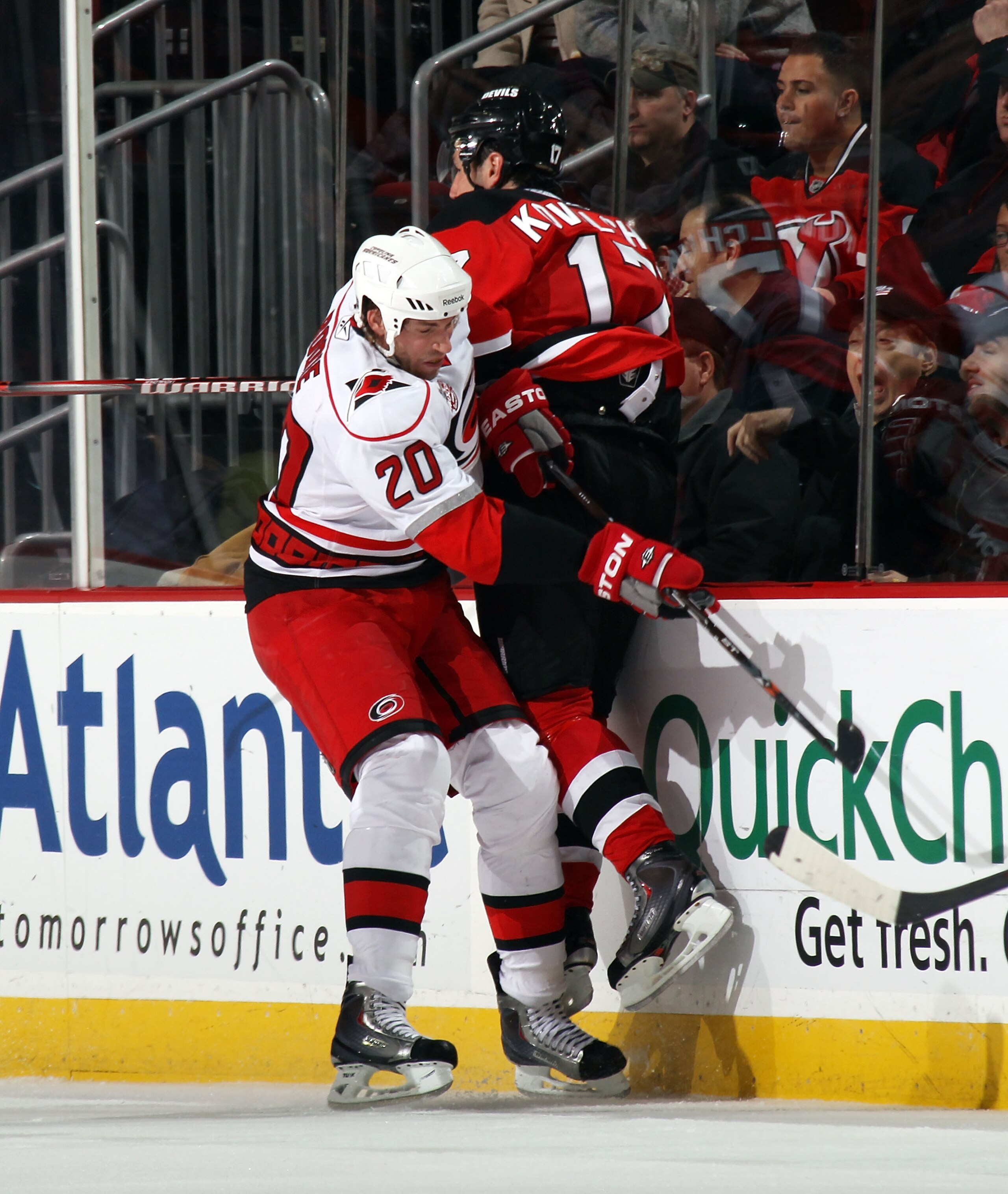 NEWARK, NJ - FEBRUARY 16: Troy Bodie #20 of the Carolina Hurricanes boards Ilya Kovalchuk #17 of the New Jersey Devils at the Prudential Center on February 16, 2011 in Newark, New Jersey.  (Photo by Bruce Bennett/Getty Images)