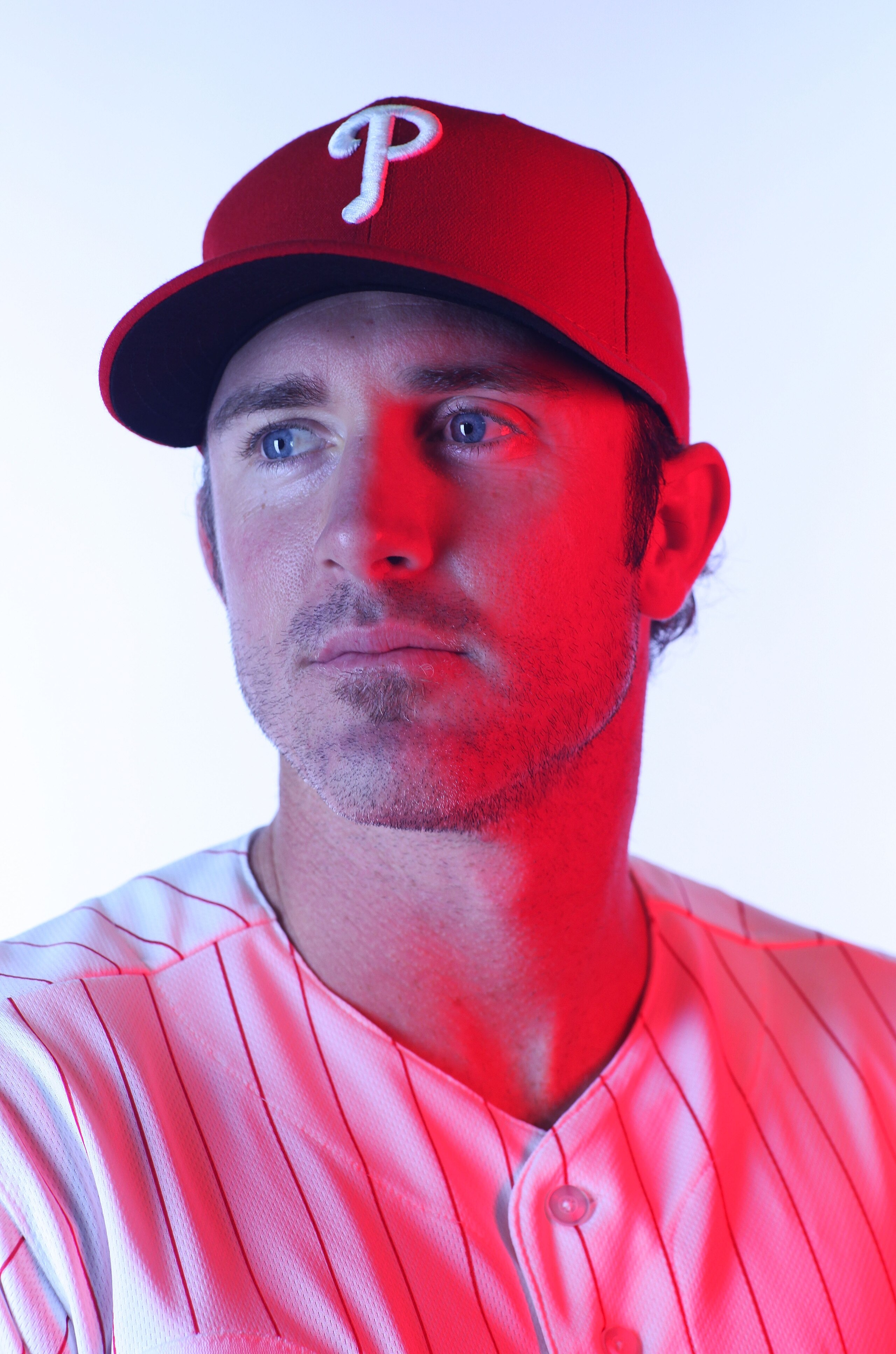 CLEARWATER, FL - FEBRUARY 22:  (EDITORS NOTE: Image was shot with a colored gel on lights) Chase Utley #26 of the Philadelphia Phillies poses for a photo during Spring Training Media Photo Day at Bright House Networks Field on February 22, 2011 in Clearwa