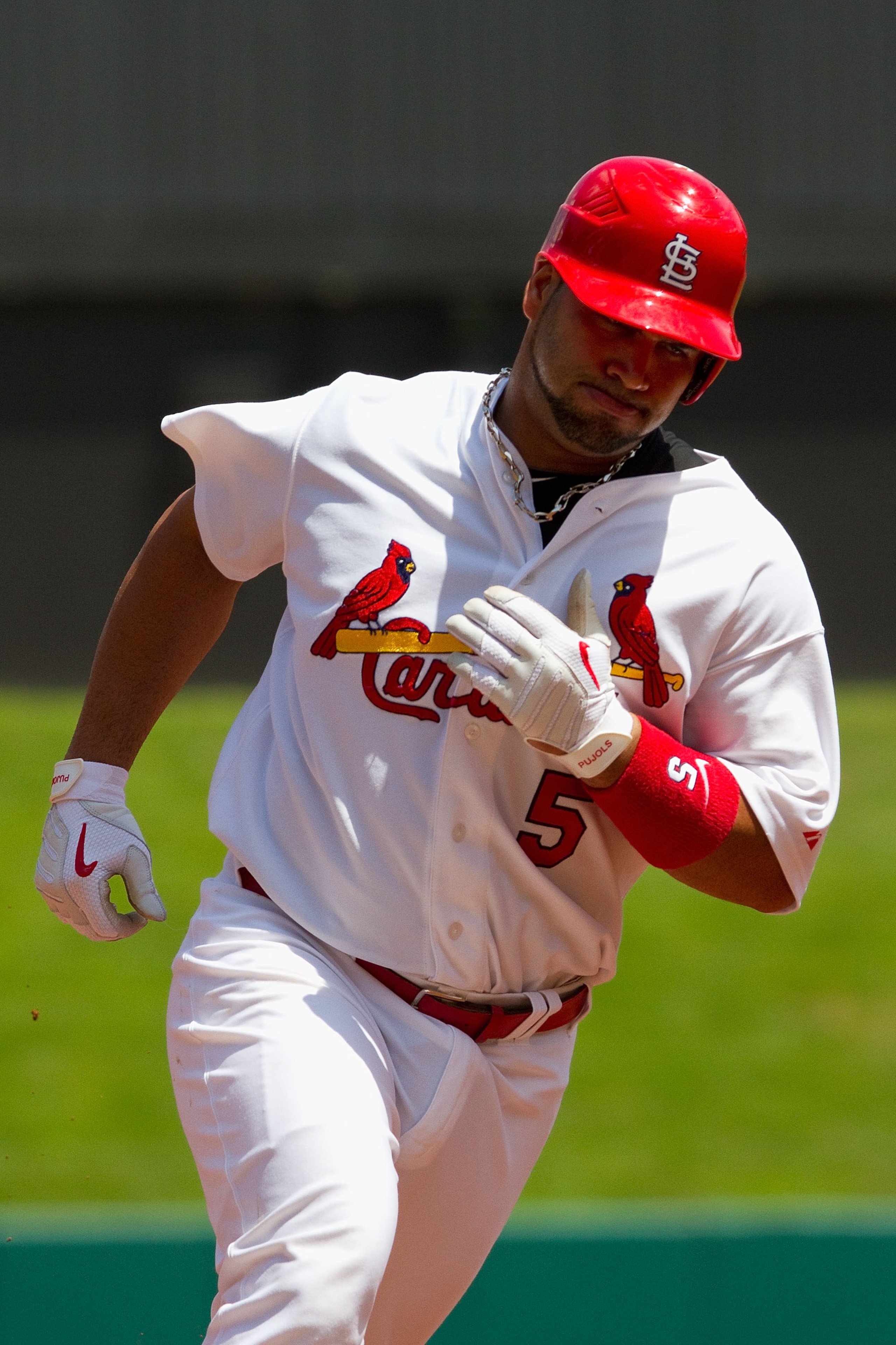 ST. LOUIS - AUGUST 15: Albert Pujols #5 of the St. Louis Cardinals rounds the bases after hitting a home run against the Chicago Cubs at Busch Stadium on August 15, 2010 in St. Louis, Missouri.  The Cubs beat the Cardinals 9-7.  (Photo by Dilip Vishwanat/