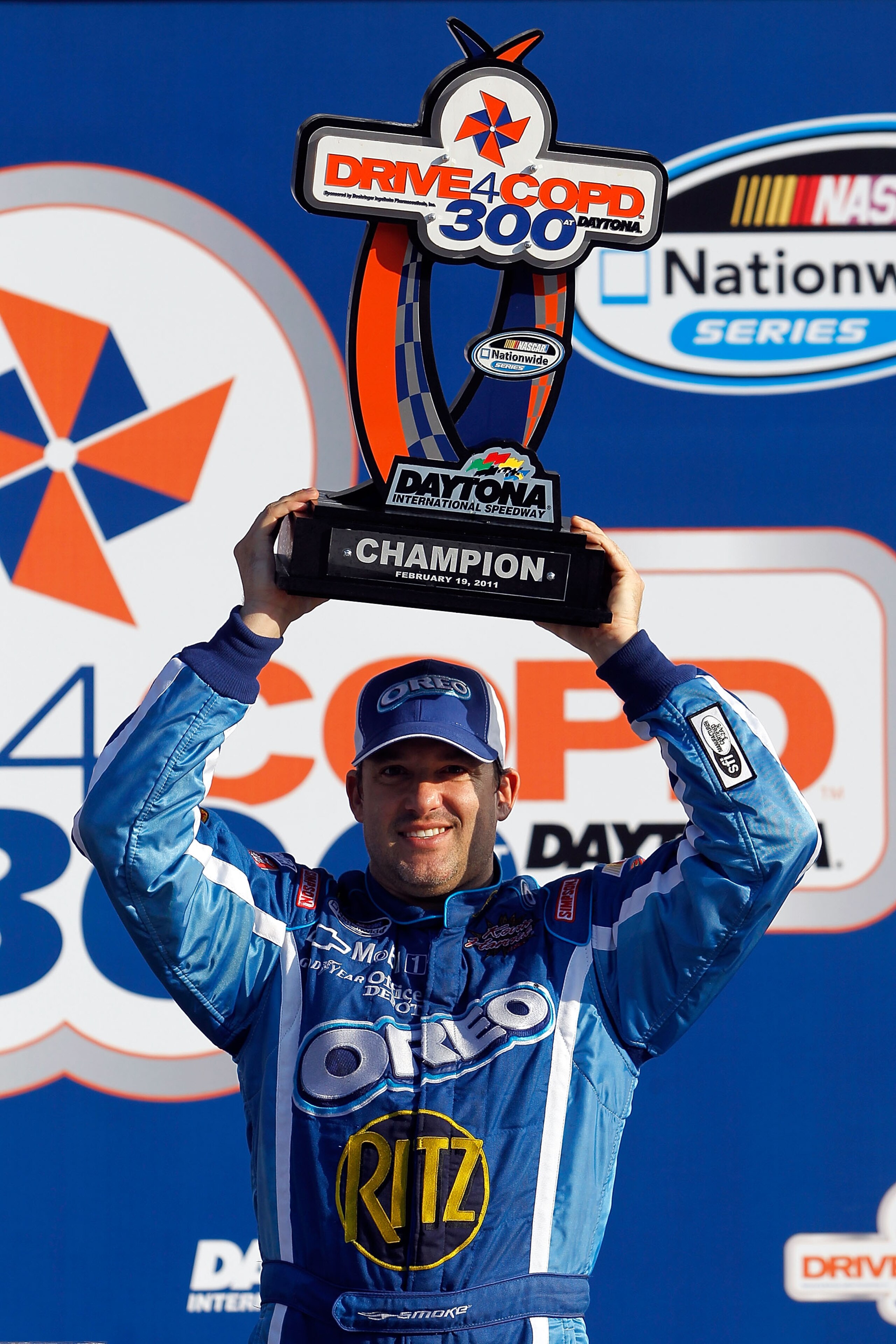 DAYTONA BEACH, FL - FEBRUARY 19:  Tony Stewart, driver of the #4 Oreo/Ritz Chevrolet, celebrates in Victory Lane after winning the NASCAR Nationwide Series DRIVE4COPD 300 at Daytona International Speedway on February 19, 2011 in Daytona Beach, Florida.  (