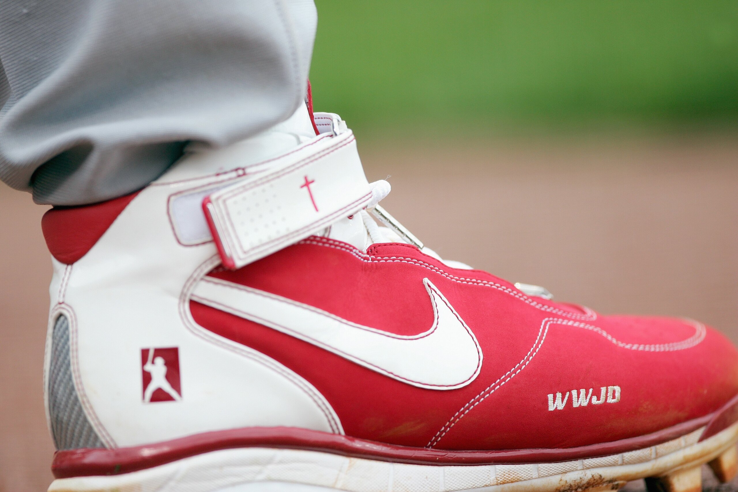 SAN FRANCISCO - APRIL 19: A view of Albert Pujols #5 of the St. Louis Cardinals shoe showing the Pujoles Family Foundation and WWJS 'What would Jesus do?'taken on the field against the San Francisco Giants during a Major League Baseball game on April 19, 