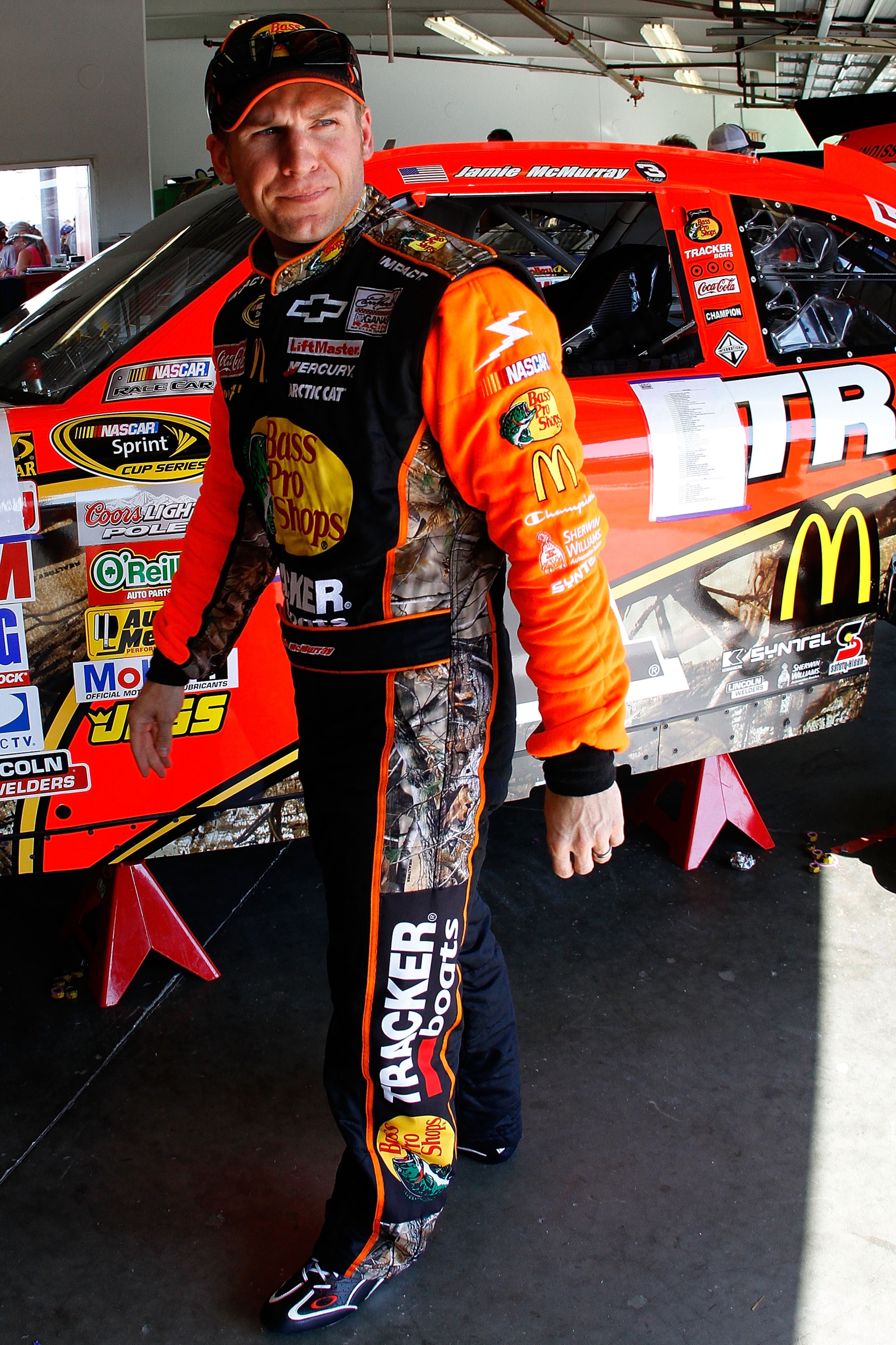 DAYTONA BEACH, FL - FEBRUARY 19:  Jamie McMurray, driver of the #1 Bass Pro Shops Chevrolet, stands in the garage area during practice for the NASCAR Sprint Cup Series Daytona 500 at Daytona International Speedway on February 19, 2011 in Daytona Beach, Fl
