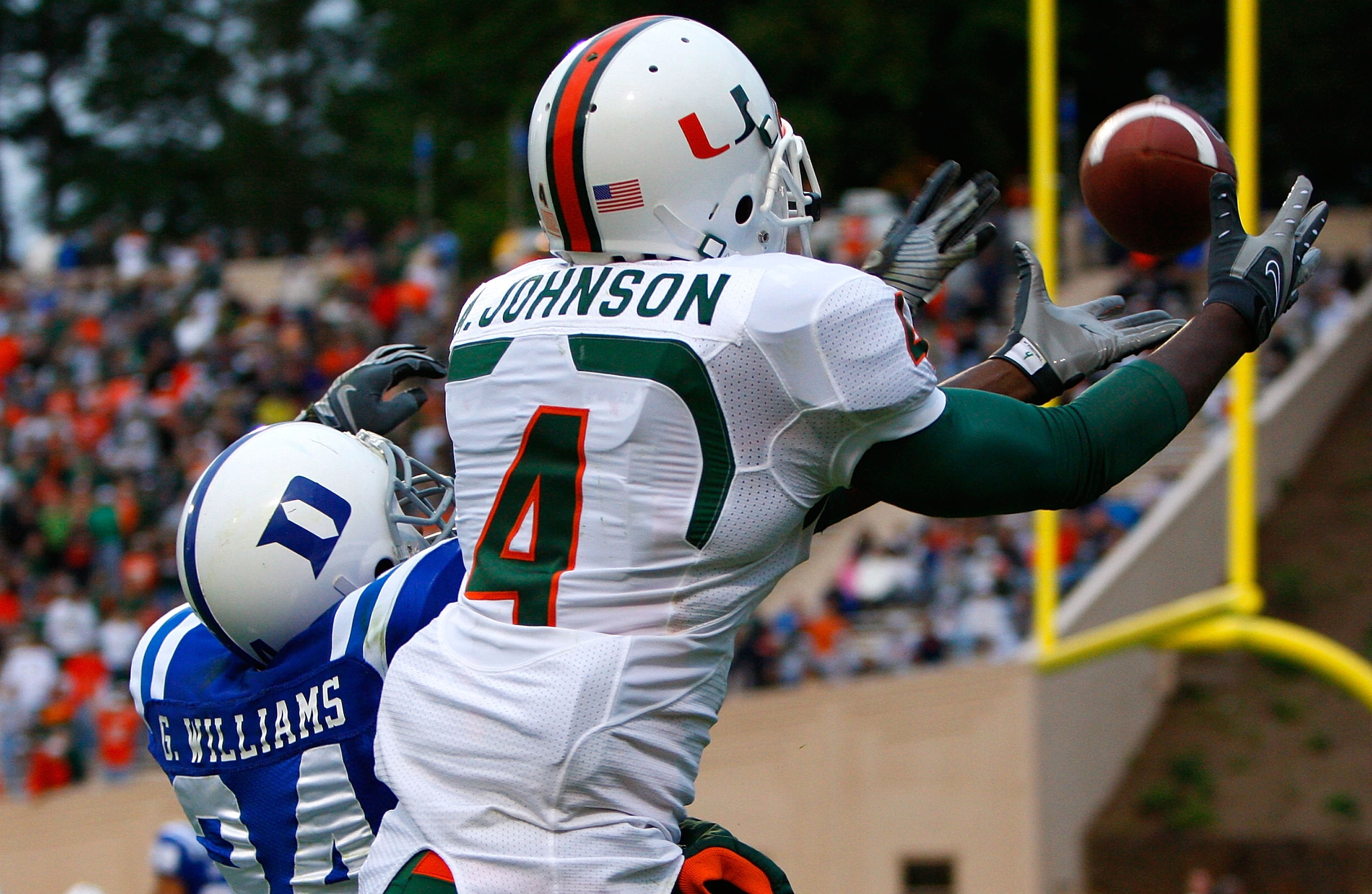 DURHAM, NC - OCTOBER 18: Receiver Aldarius Johnson #4 of the Miami Hurricanes pulls in this touchdown reception against Glenn Williams #24 of the Duke Blue Devils during the game at Wallace Wade Stadium on October 18, 2008 in Durham, North Carolina. (Ph DURHAM, NC - OCTOBER 18: Receiver Aldarius Johnson #4 of the Miami Hurricanes pulls in this touchdown reception against Glenn Williams #24 of the Duke Blue Devils during the game at Wallace Wade Stadium on October 18, 2008 in Durham, North Carolina. (Ph