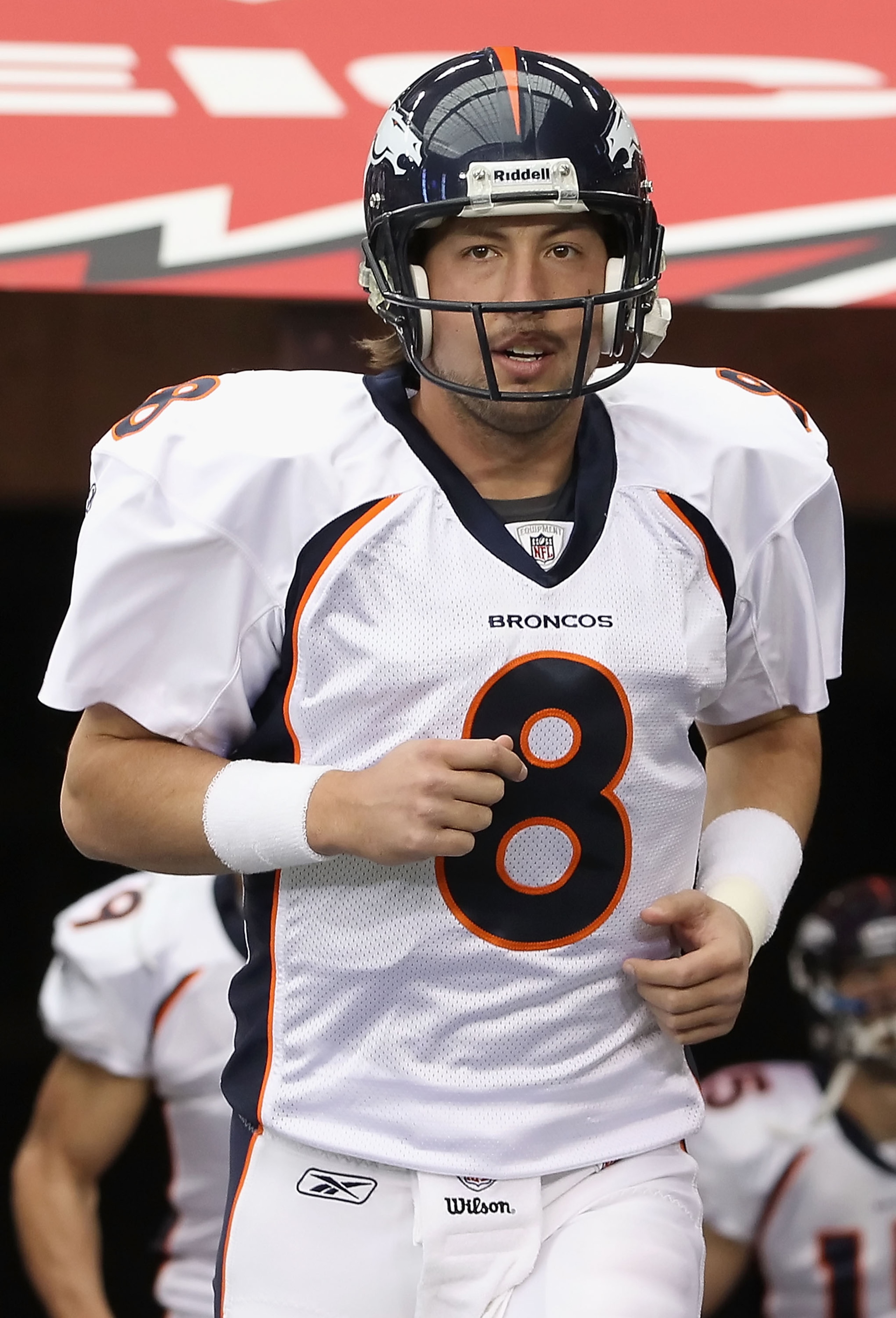 GLENDALE, AZ - DECEMBER 12:  Quarterback Kyle Orton #8 of the Denver Broncos runs out onto the field before the NFL game against the Arizona Cardinals at the University of Phoenix Stadium on December 12, 2010 in Glendale, Arizona.  The Cardinals defeated