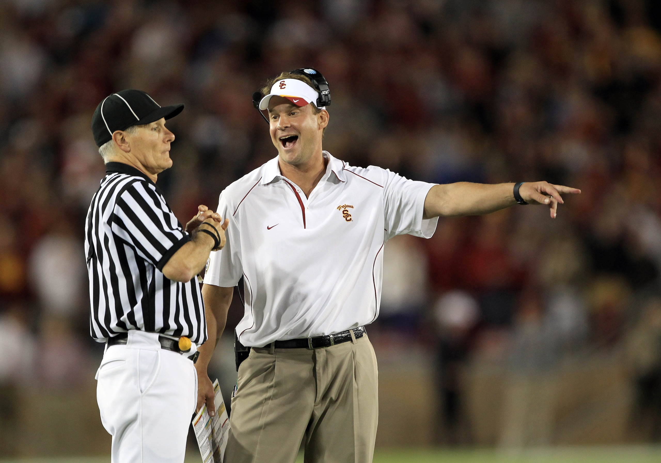 PALO ALTO, CA - OCTOBER 09: USC Trojans head coach Lane Kiffin speaks with side judge Mike Weseloh during their loss to the Stanford Cardinal at Stanford Stadium on October 9, 2010 in Palo Alto, California. (Photo by Ezra Shaw/Getty Images) PALO ALTO, CA - OCTOBER 09: USC Trojans head coach Lane Kiffin speaks with side judge Mike Weseloh during their loss to the Stanford Cardinal at Stanford Stadium on October 9, 2010 in Palo Alto, California. (Photo by Ezra Shaw/Getty Images)