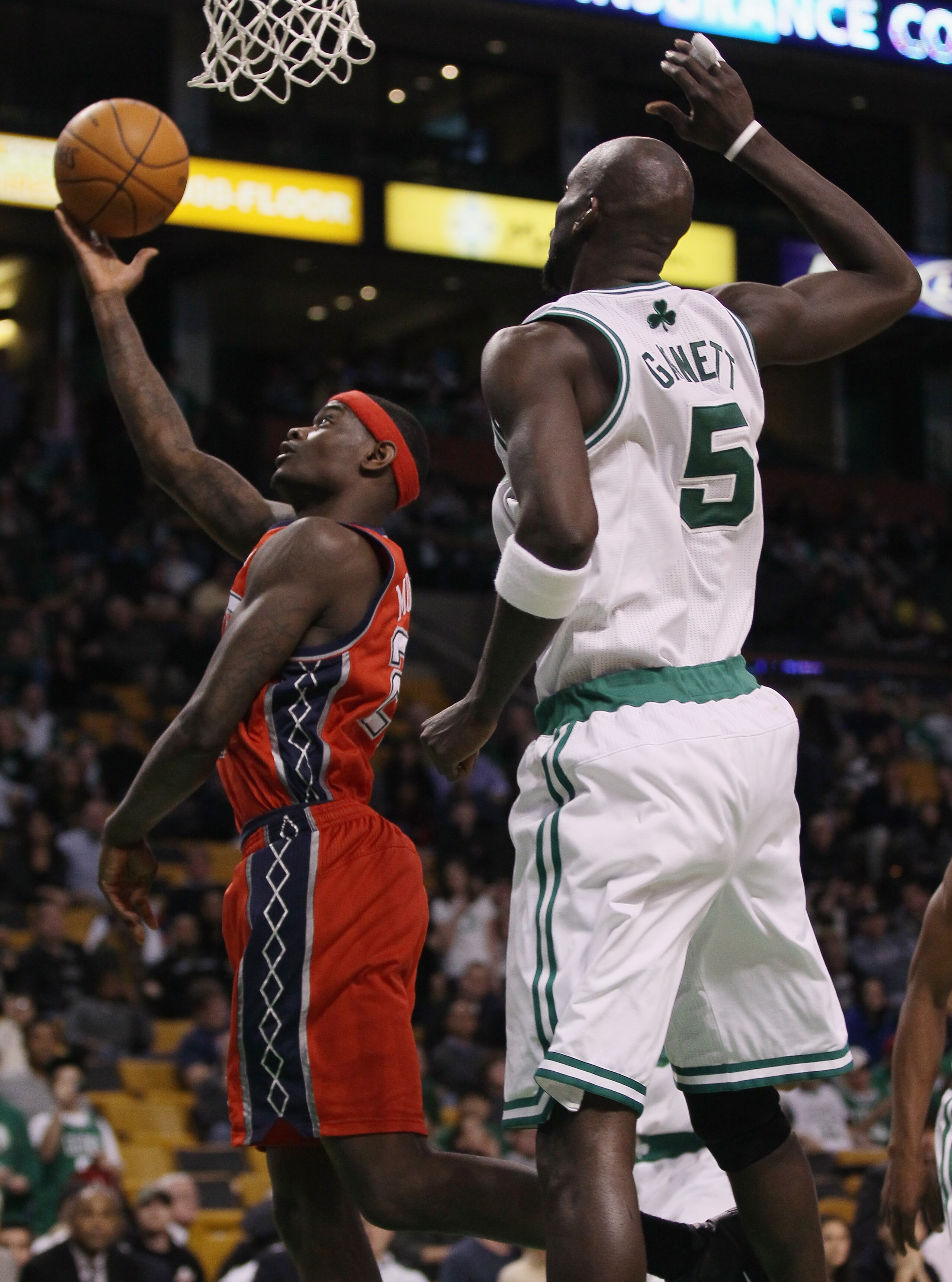 BOSTON - NOVEMBER 24:  Anthony Morrow #22 of the New Jersey Nets takes a shot as Kevin Garnett #5 of the Boston Celtics defends on November 24, 2010 at the TD Garden in Boston, Massachusetts. The Celtics defeated the nets 89-83. NOTE TO USER: User express