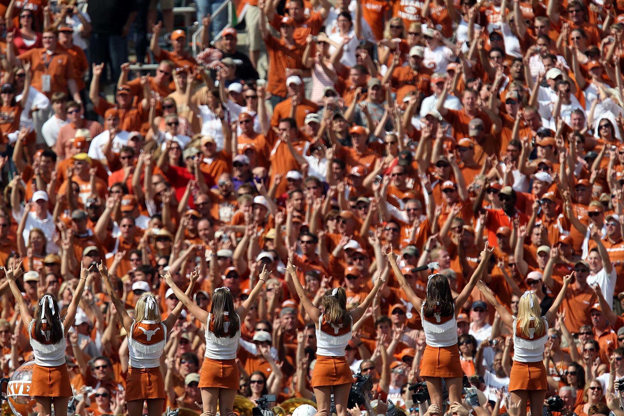 DALLAS - OCTOBER 11:  Fans of theTexas Longhorns cheer during play against the Oklahoma Sooners at the Cotton Bowl on October 11, 2008 in Dallas, Texas.  (Photo by Ronald Martinez/Getty Images)