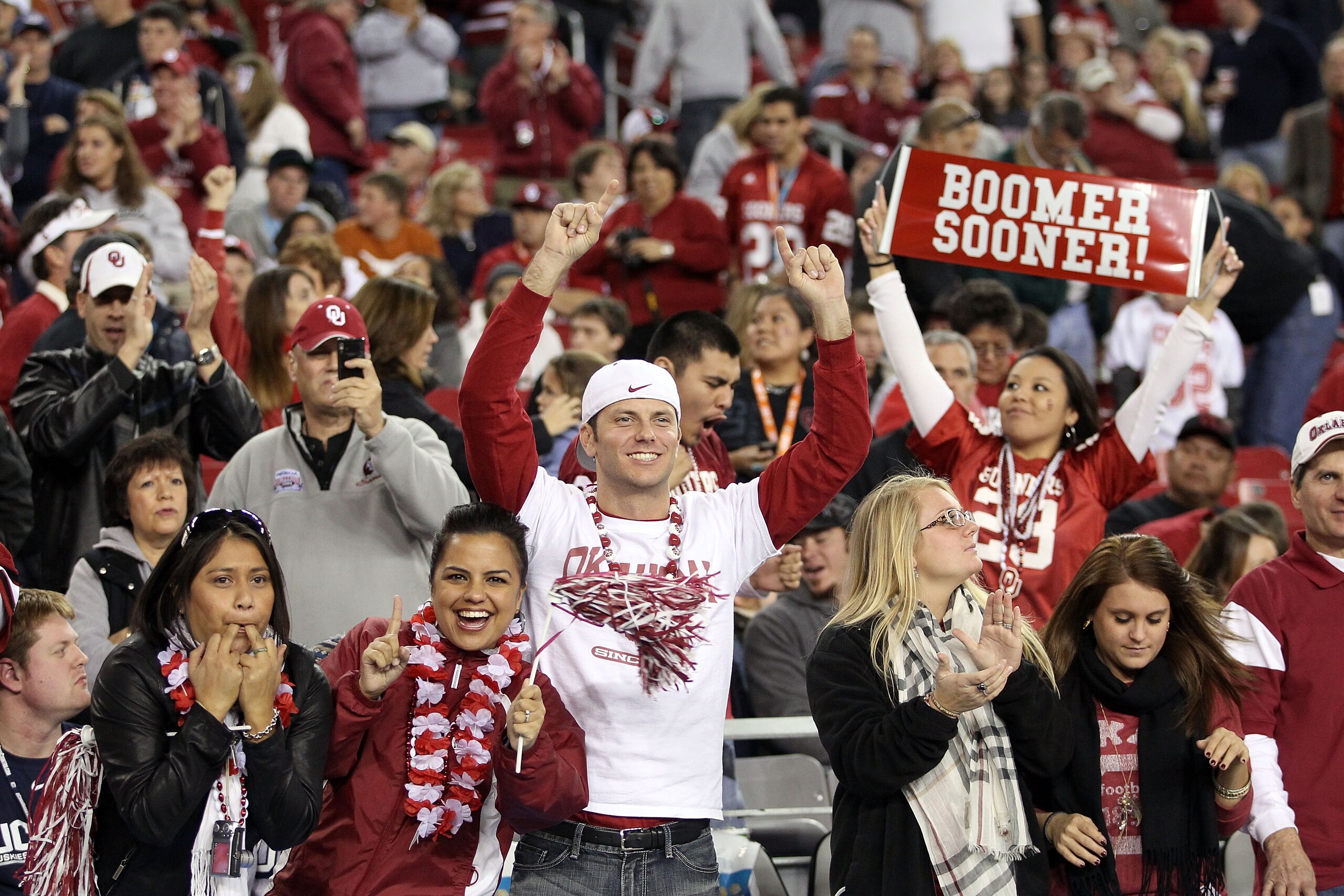 GLENDALE, AZ - JANUARY 01:  Oklahoma Sooners fans cheer late in the fourth quarter while taking on the Connecticut Huskies during the Tostitos Fiesta Bowl at the Universtity of Phoenix Stadium on January 1, 2011 in Glendale, Arizona.  (Photo by Christian
