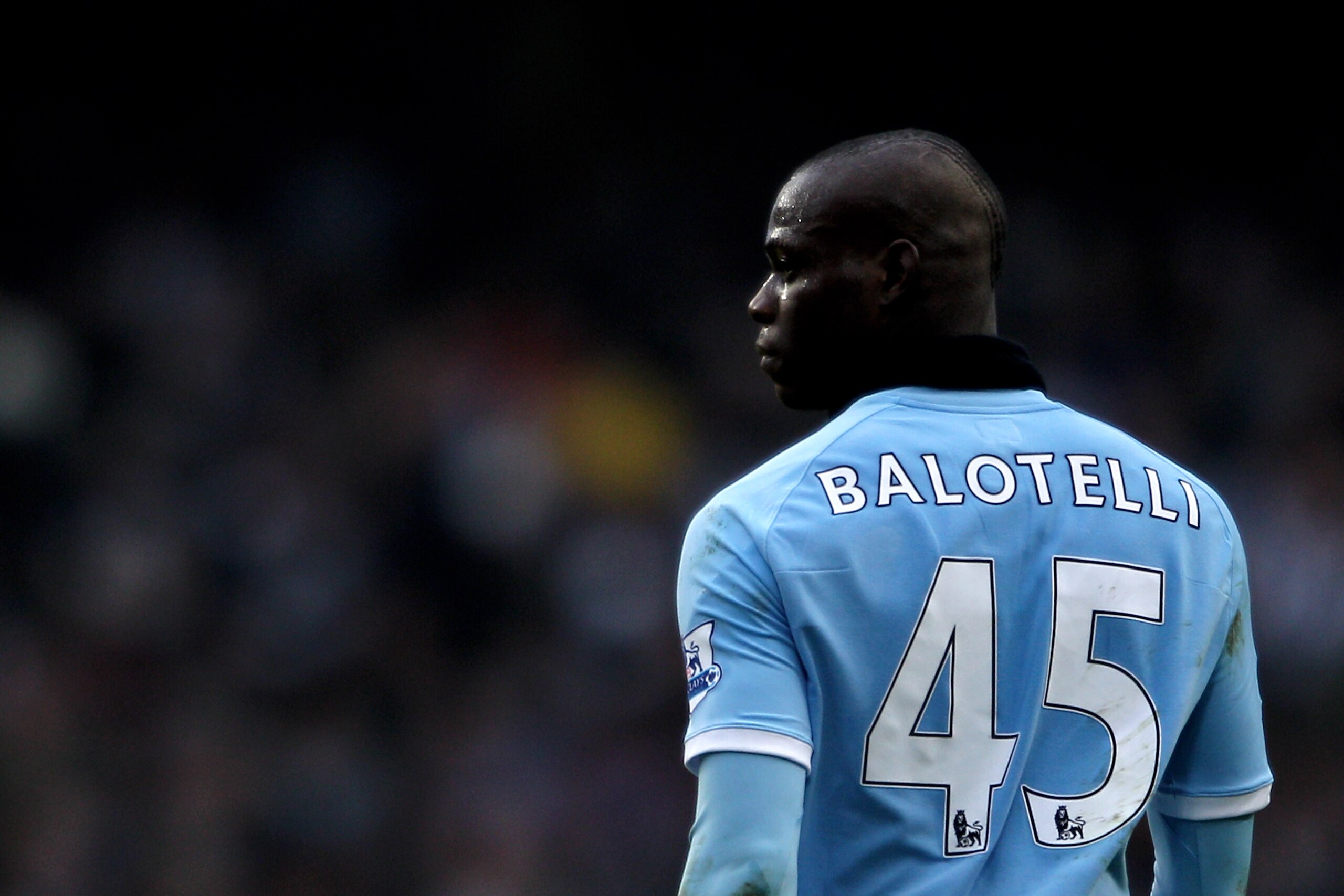 MANCHESTER, ENGLAND - FEBRUARY 20: Mario Balotelli of Manchester City looks on during the FA Cup sponsored by E.On 4th Round replay match between Manchester City and Notts County at City of Manchester Stadium on February 20, 2011 in Manchester, England. MANCHESTER, ENGLAND - FEBRUARY 20: Mario Balotelli of Manchester City looks on during the FA Cup sponsored by E.On 4th Round replay match between Manchester City and Notts County at City of Manchester Stadium on February 20, 2011 in Manchester, England.