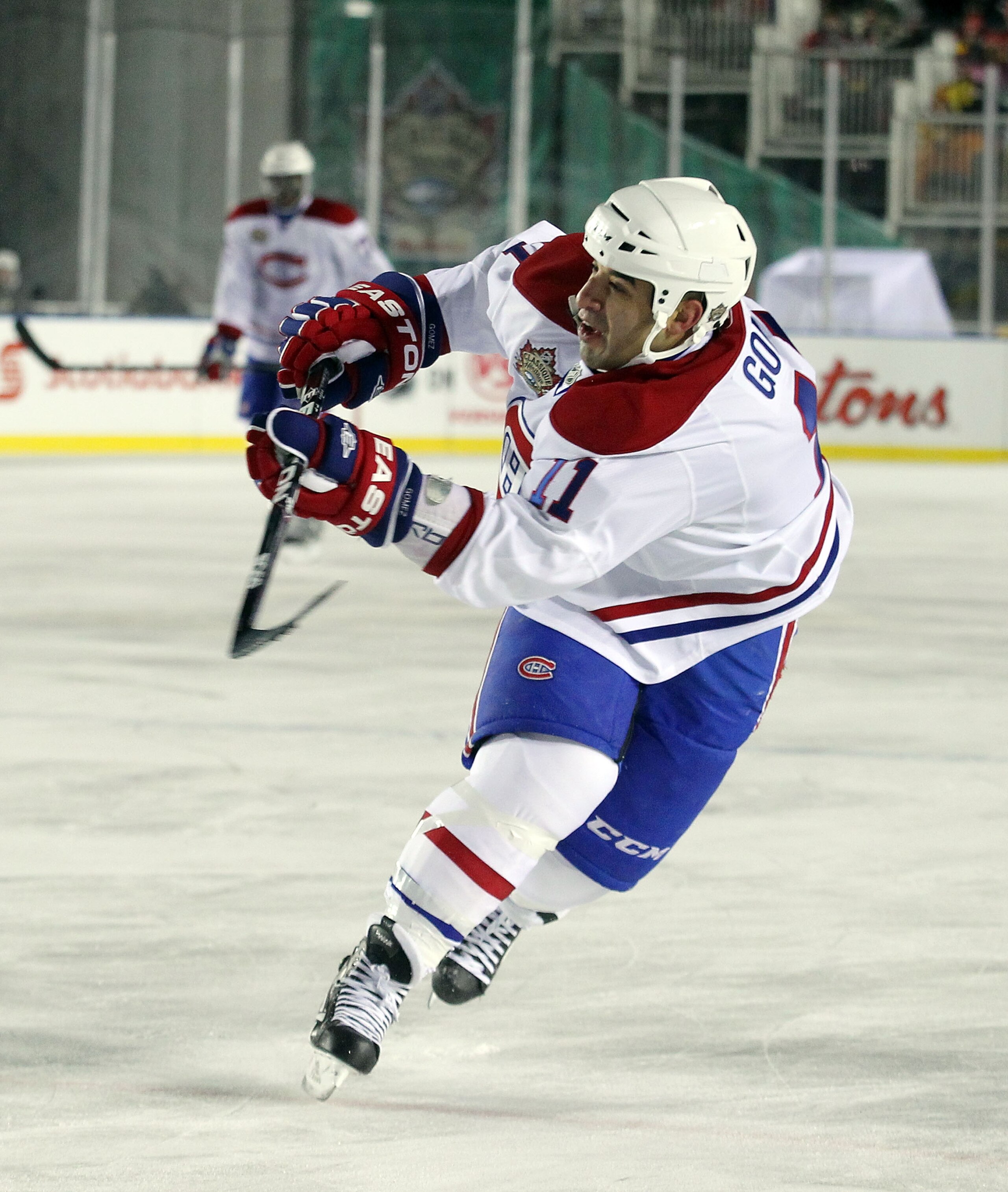 CALGARY, AB - FEBRUARY 20:  Scott Gomez #11 of the Montreal Canadiens skates against the Calgary Flames during the 2011 NHL Heritage Classic Game at McMahon Stadium on February 20, 2011 in Calgary, Alberta, Canada. The Flames defeated the Canadiens 4-0.
