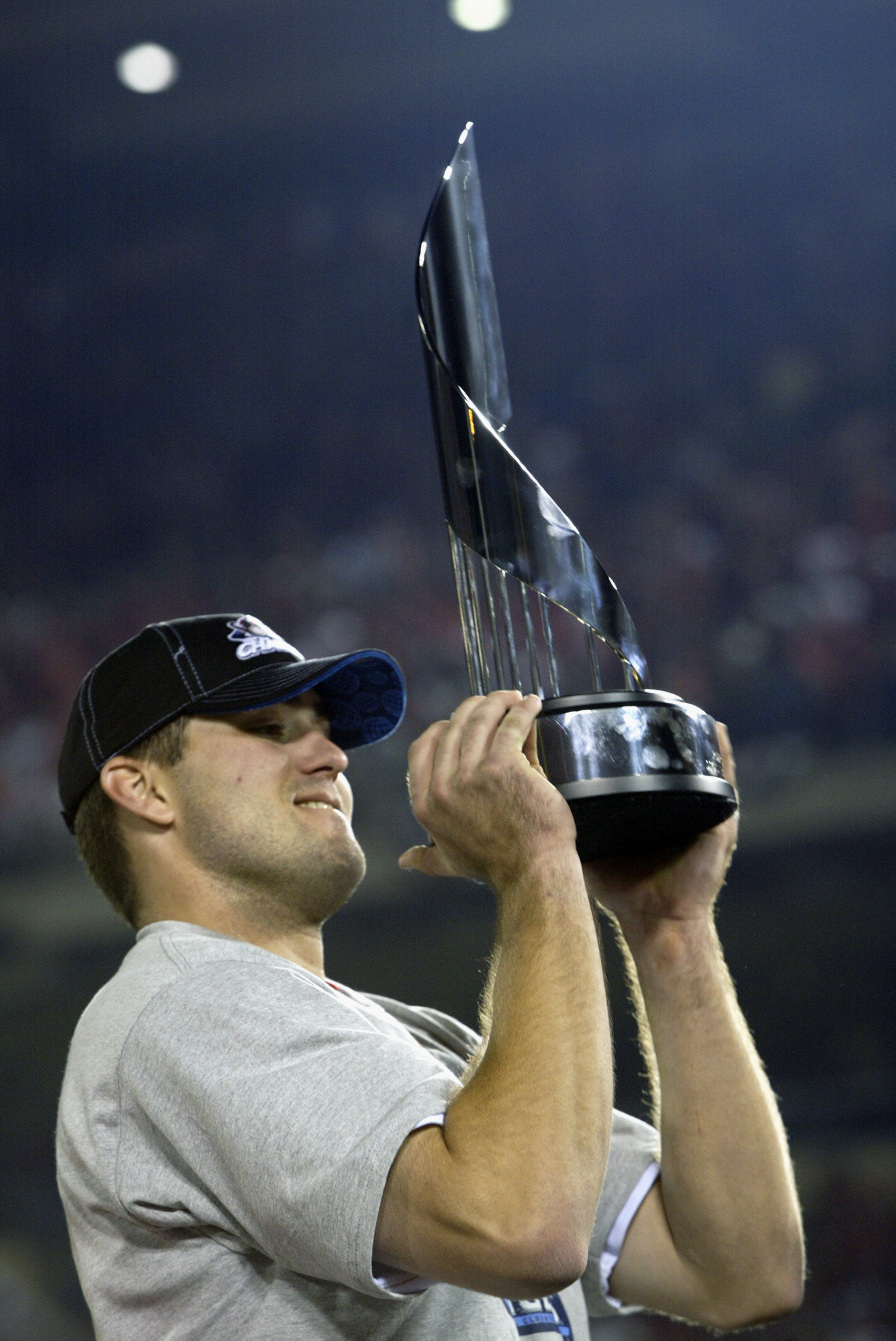 Troy Glaus of the Anaheim Angels holds up the World Series trophy News  Photo - Getty Images