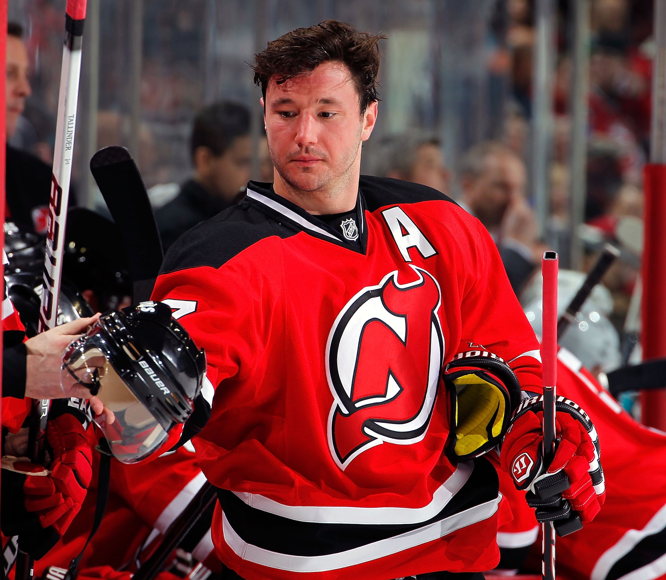 NEWARK, NJ - FEBRUARY 11: Ilya Kovalchuk #17 of the New Jersey Devils reaches to take his helmet in a timeout during an NHL hockey game against the San Jose Sharks on February 11, 2011 at the Prudential Center in Newark, New Jersey. (Photo by Paul Bereswi