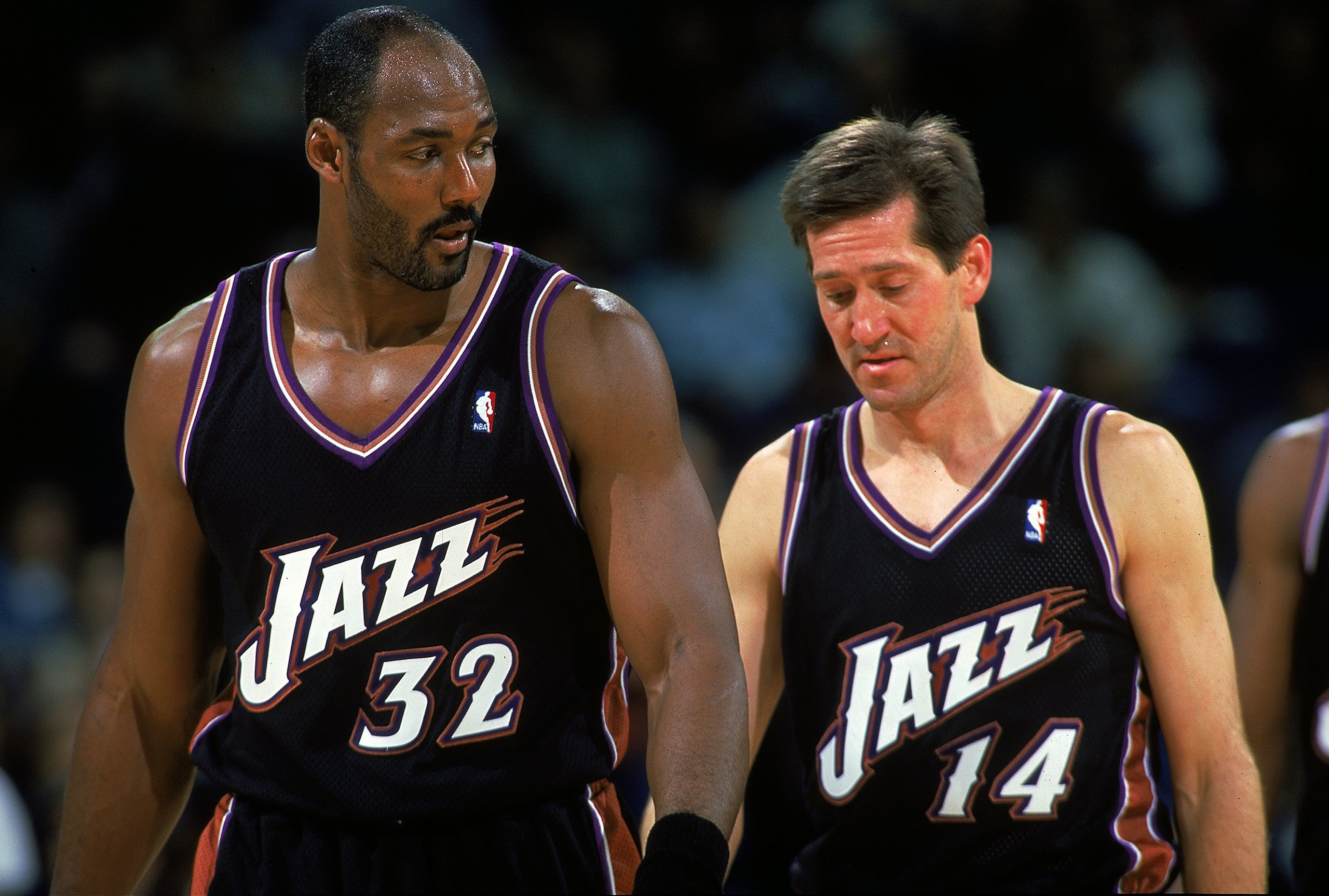 4 Dec 1999:  Karl Malone #32 and Jeff Hornacek #14 of the Utah Jazz walking back onto the court from a time out during the game against the Golden State Warriors at the Oakland Coliseum in Oakland, California. The Jazz defeated the Warriors 94-82.     Man