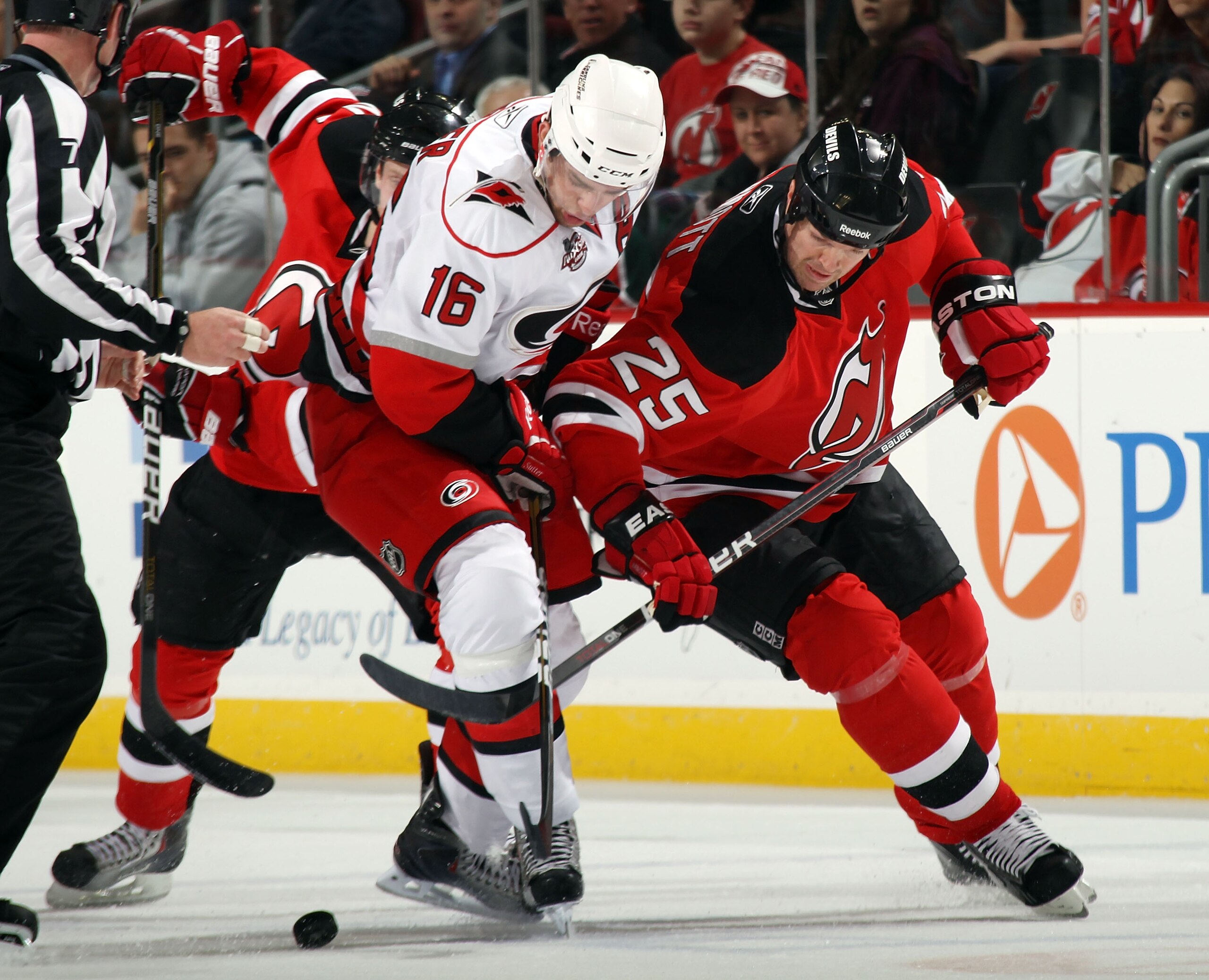 NEWARK, NJ - FEBRUARY 16: Brandon Sutter #16 of the Carolina Hurricanes and Jason Arnott #25 of the New Jersey Devils battle for the puck at the Prudential Center on February 16, 2011 in Newark, New Jersey.  (Photo by Bruce Bennett/Getty Images)