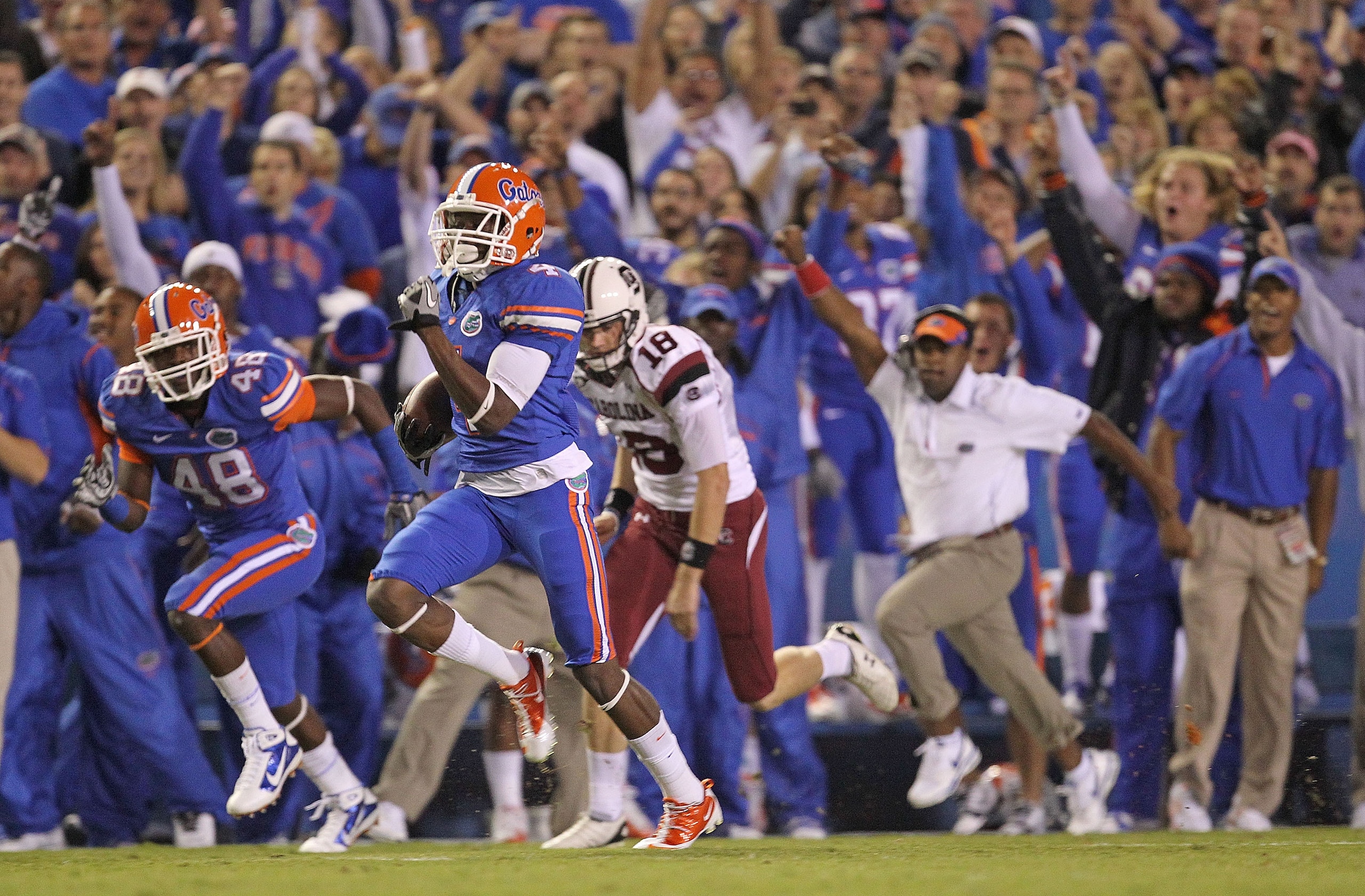 GAINESVILLE, FL - NOVEMBER 13:  Andre Debose #4 of the Florida Gators returns the opening kickoff for a touchdown during a game against the South Carolina Gamecocks at Ben Hill Griffin Stadium on November 13, 2010 in Gainesville, Florida.  (Photo by Mike