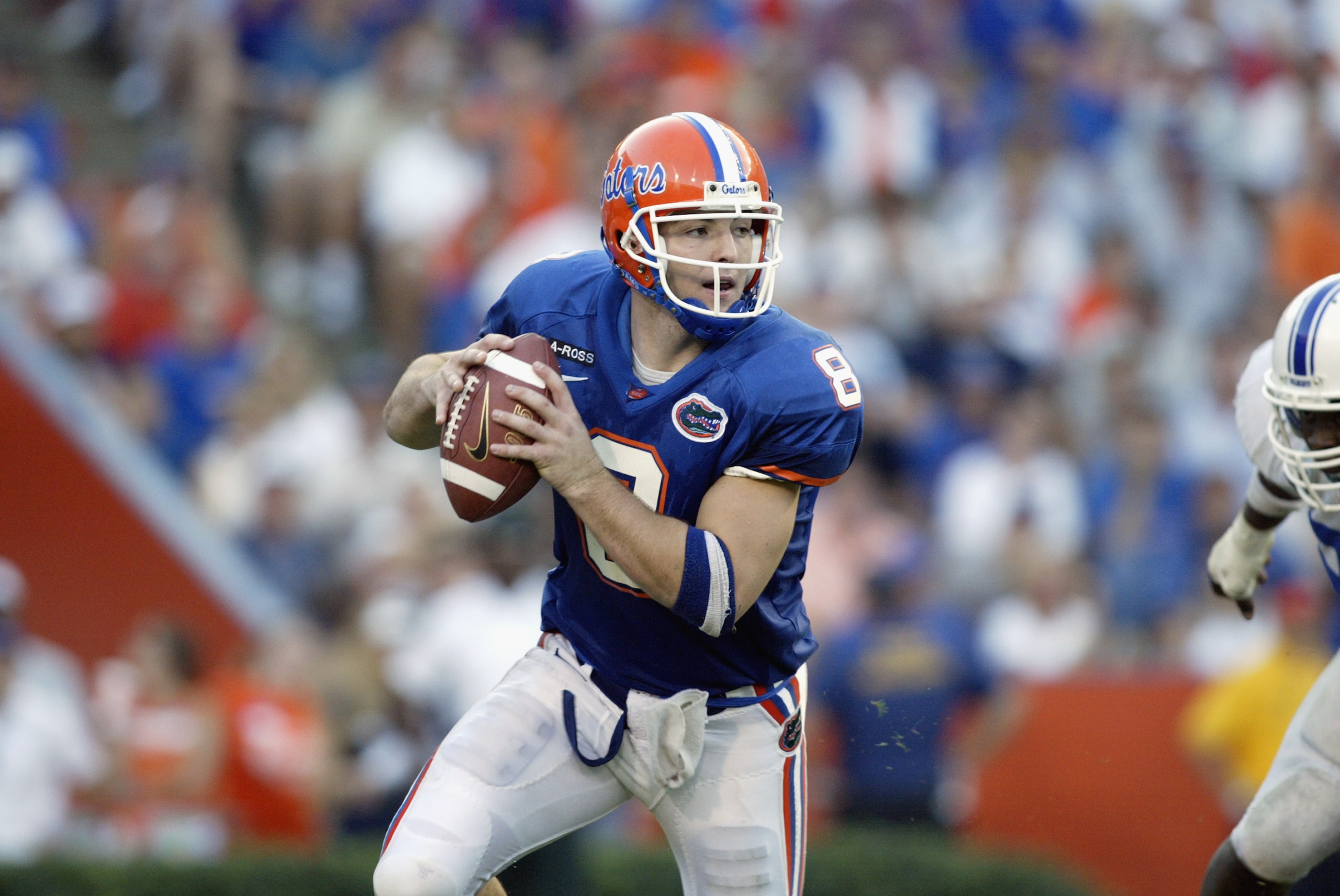 GAINESVILLE, FL - SEPTEMBER 28:  Quarterback Rex Grossman #8 of the Florida Gators rolls to his right during the Southeastern Conference football game against the Kentucky Wildcats on September 28, 2002 at Florida Field in Gainesville, Florida.  The Gator