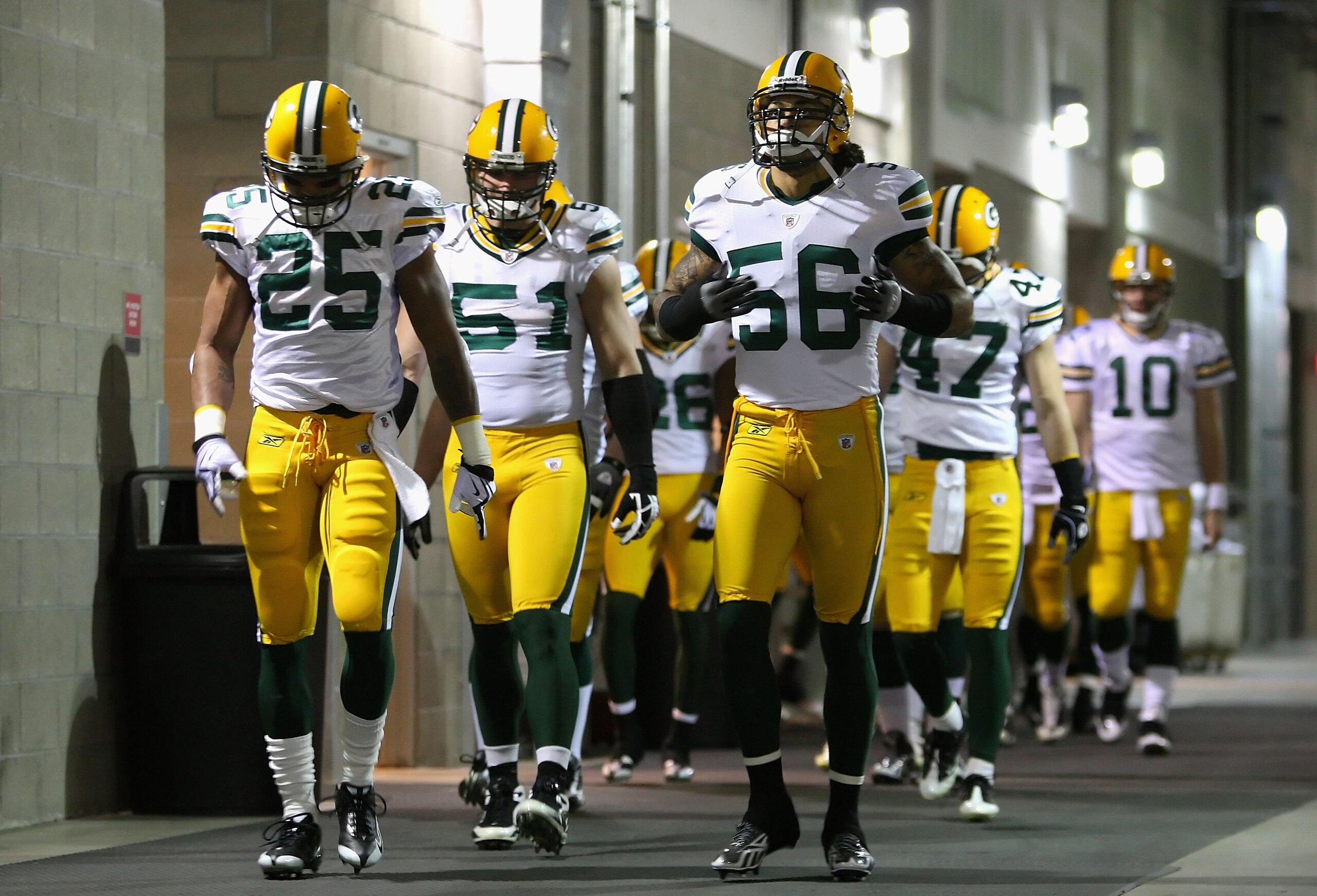 GLENDALE, AZ - JANUARY 10:  Linebacker Nick Barnett #56 of the Green Bay Packers walks with teammates out to the field prior to the 2010 NFC wild-card playoff game against the Arizona Cardinals at the Universtity of Phoenix Stadium on January 10, 2010 in