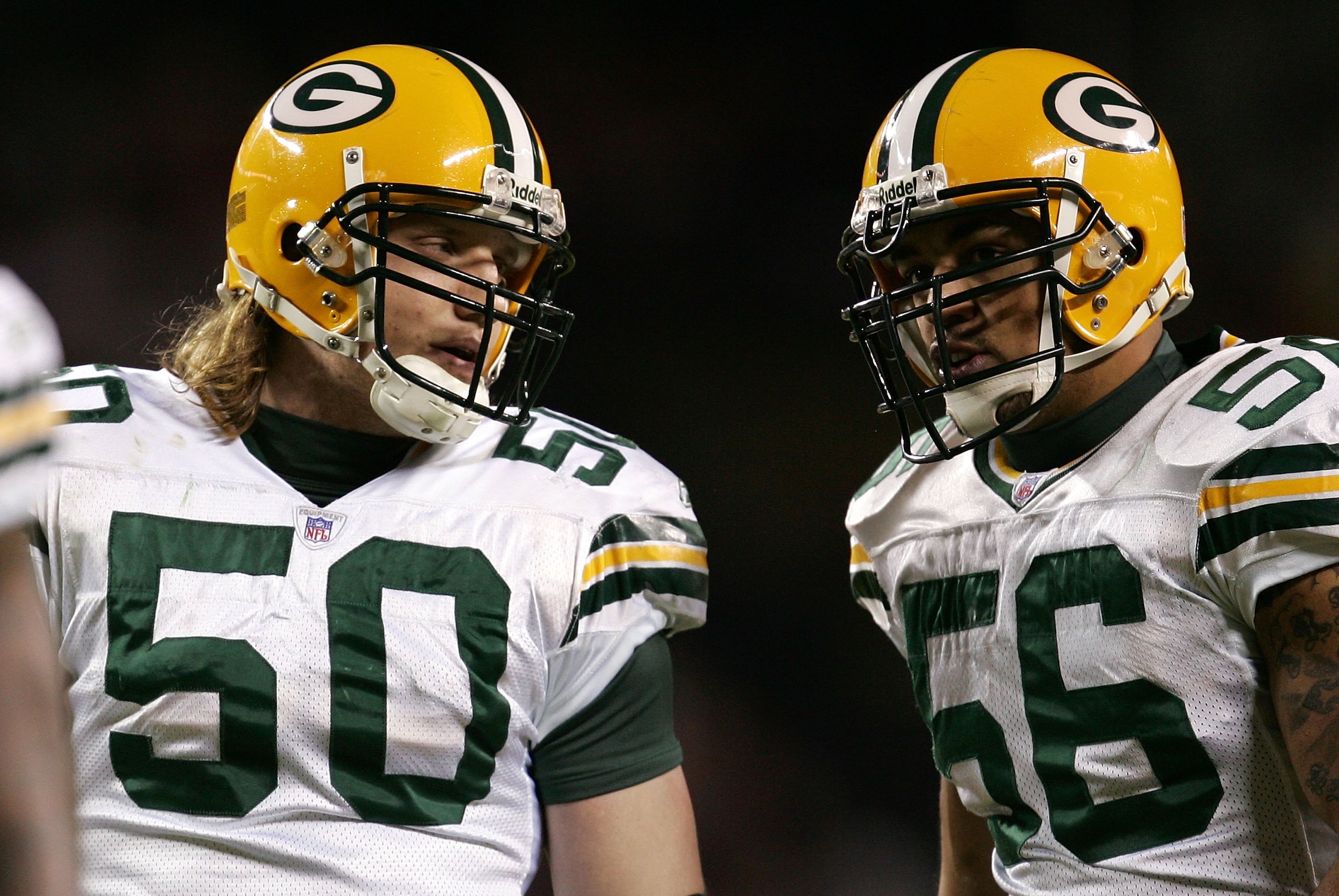 CHICAGO - DECEMBER 31:  Linebackers Nick Barnett #56 and A.J. Hawk #50 (L) of the Green Bay Packers talk on the field against the Chicago Bears December 31, 2006 at Soldier Field in Chicago, Illinois. The Packers won 26-7.  (Photo by Jonathan Daniel/Getty