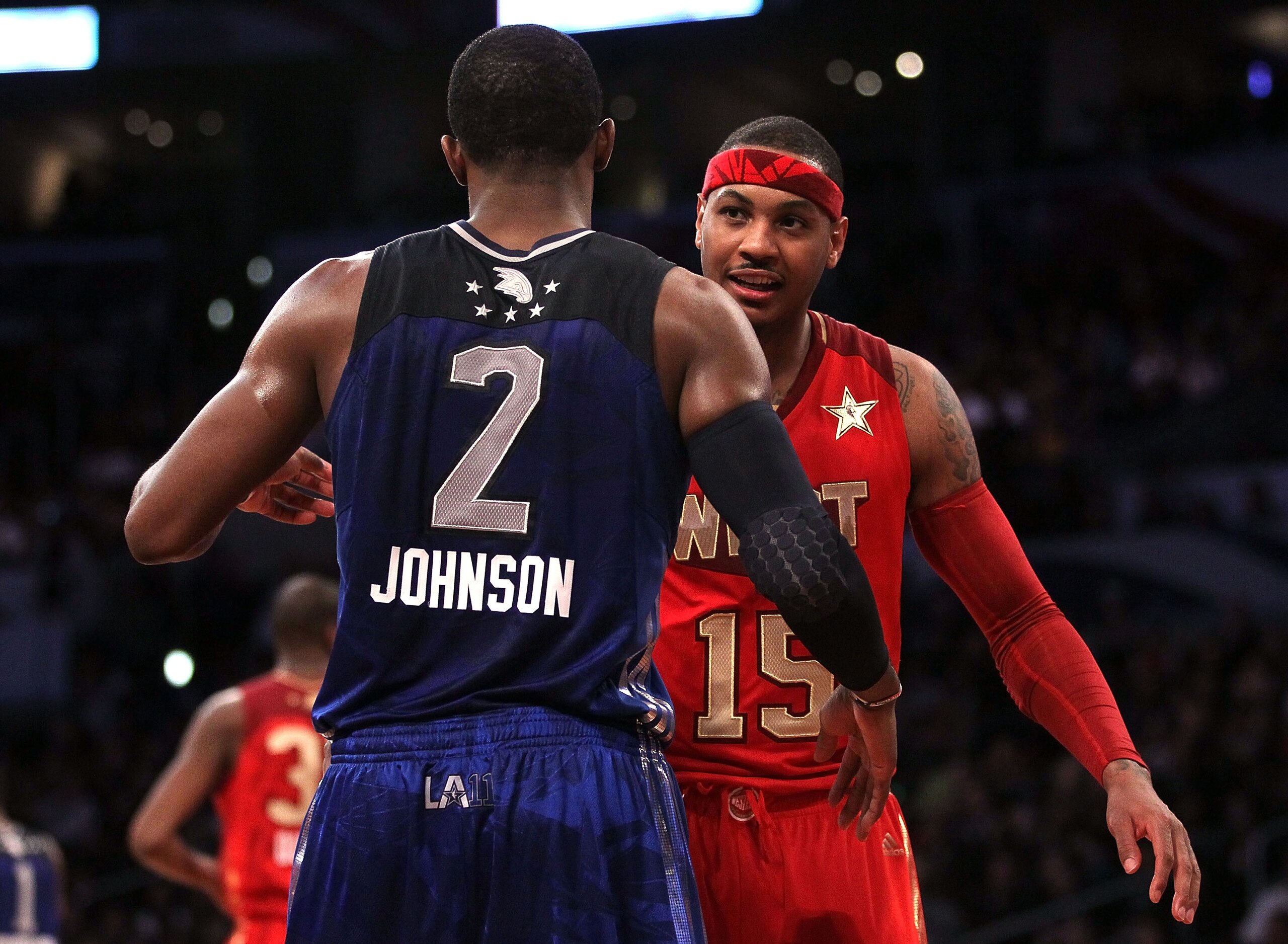 LOS ANGELES, CA - FEBRUARY 20:  Carmelo Anthony #15 of the Denver Nuggets and the Western Conference hugs Joe Johnson #2 of the Atlanta Hawks and the Eastern Conference after the 2011 NBA All-Star Game at Staples Center on February 20, 2011 in Los Angeles