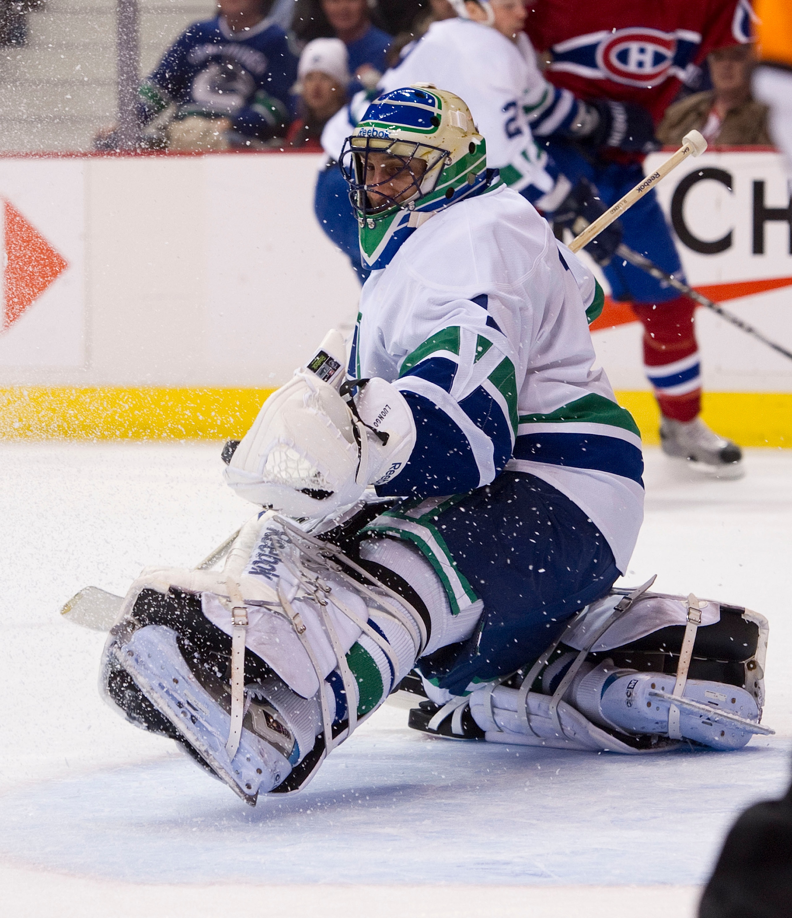 VANCOUVER, CANADA - FEBRUARY 22: Goalie Roberto Luongo #1 of the Vancouver Canucks makes a glove save against the Montreal Canadiens during the first period in NHL action on February 22, 2011 at Rogers Arena in Vancouver, British Columbia, Canada.  (Photo