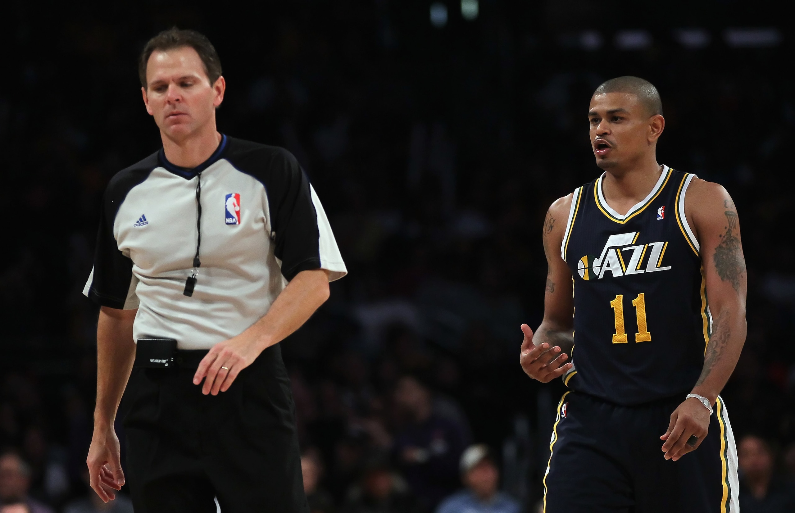 LOS ANGELES, CA - JANUARY 25:  Earl Watson #11 of the Utah Jazz argues a call with referee Mark Ayotte against the Los Angeles Lakers in the second half at Staples Center on January 25, 2011 in Los Angeles, California. The Lakers defeated the Jazz 120-91.