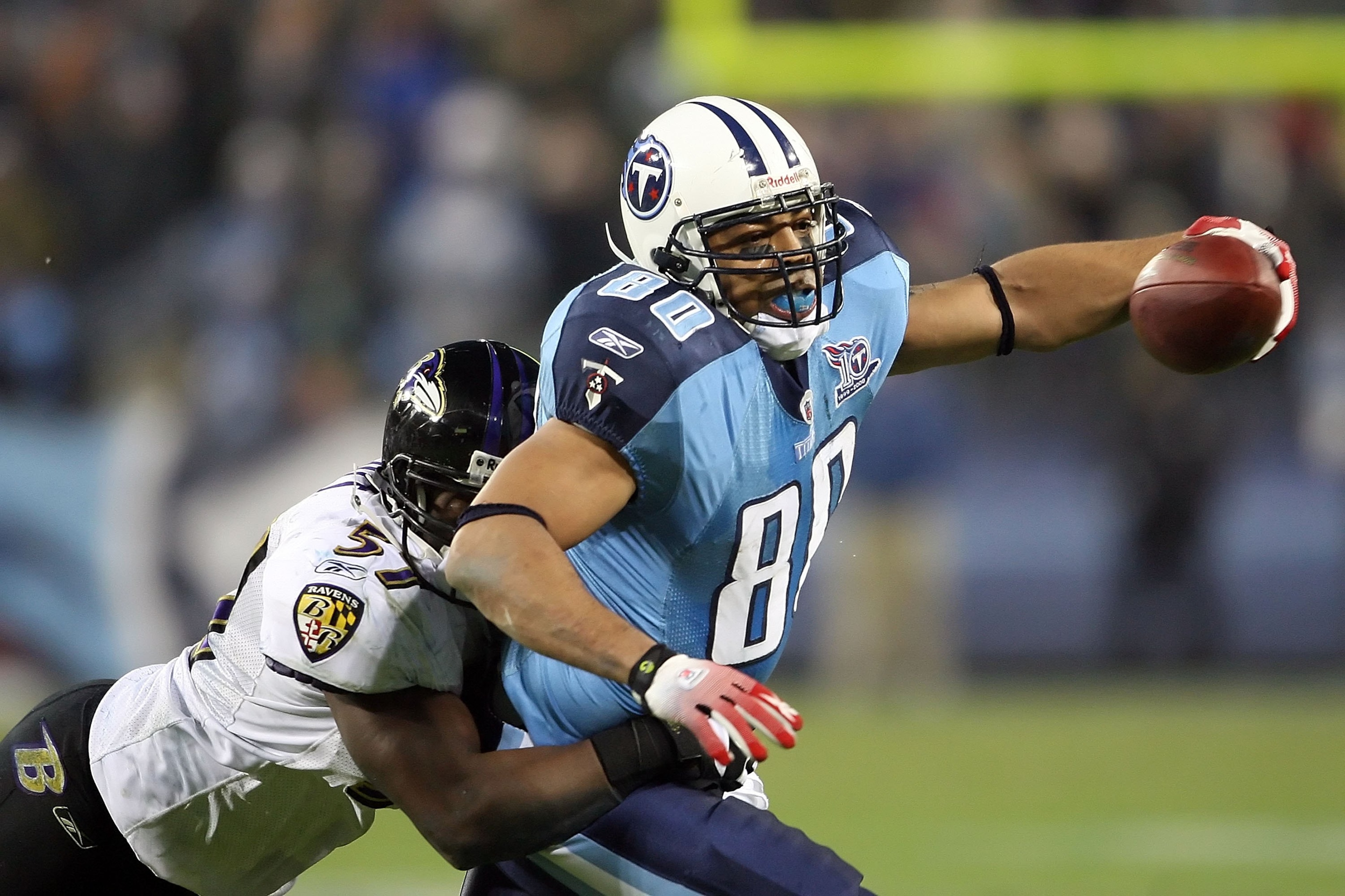 NASHVILLE, TN - JANUARY 10: Tight end Bo Scaife #80 of the Tennessee Titans looks to avoid a tackle by linebacker Bart Scott #57 of the Baltimore Ravens during the AFC Divisional Playoff Game on January 10, 2009 at LP Field in Nashville, Tennessee. (Pho NASHVILLE, TN - JANUARY 10: Tight end Bo Scaife #80 of the Tennessee Titans looks to avoid a tackle by linebacker Bart Scott #57 of the Baltimore Ravens during the AFC Divisional Playoff Game on January 10, 2009 at LP Field in Nashville, Tennessee. (Pho