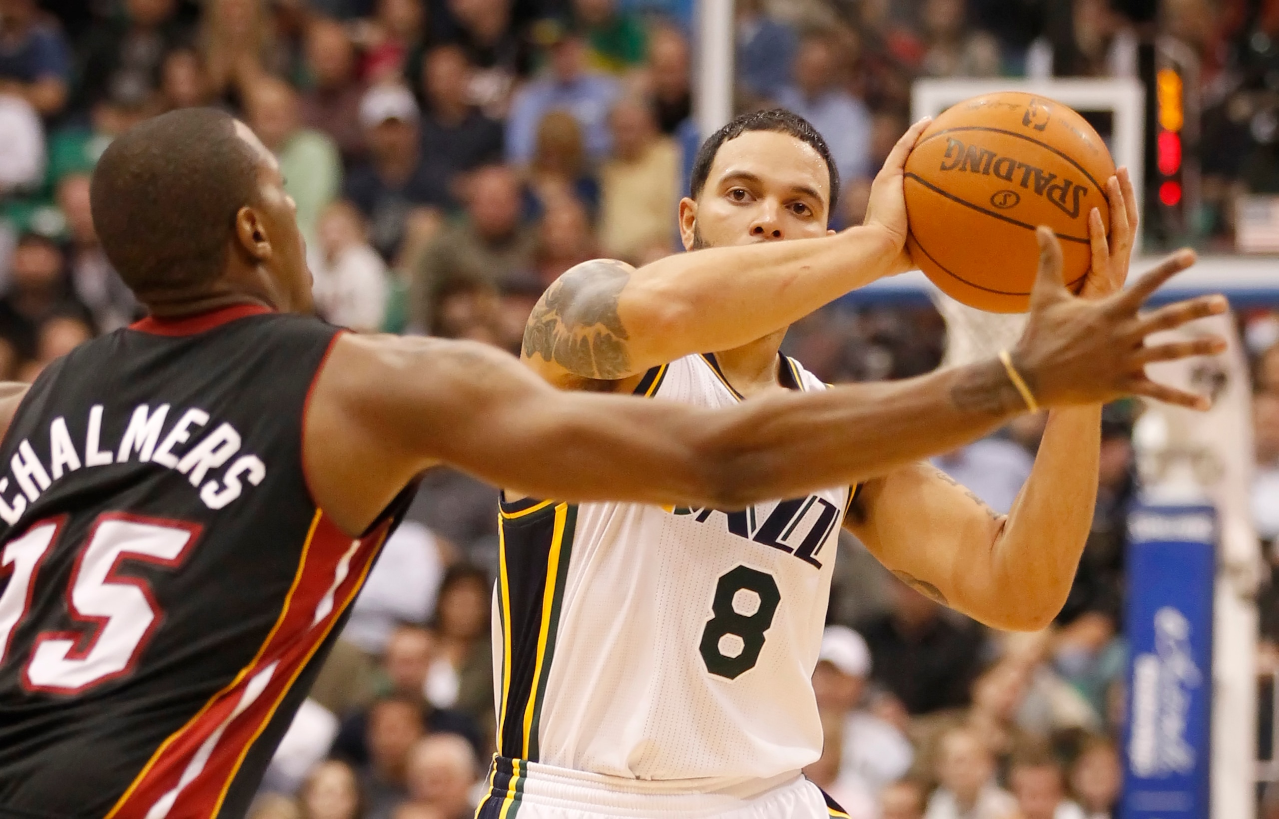 SALT LAKE CITY, UT - DECEMBER 8:  Deron Williams #8 of the Utah Jazz is pressured by Marion Chambers #15 of the Miami Heat during the second half of an NBA game December 8, 2010 at Energy Solutions Arena in Salt Lake City, Utah. The Heat beat the Jazz 111